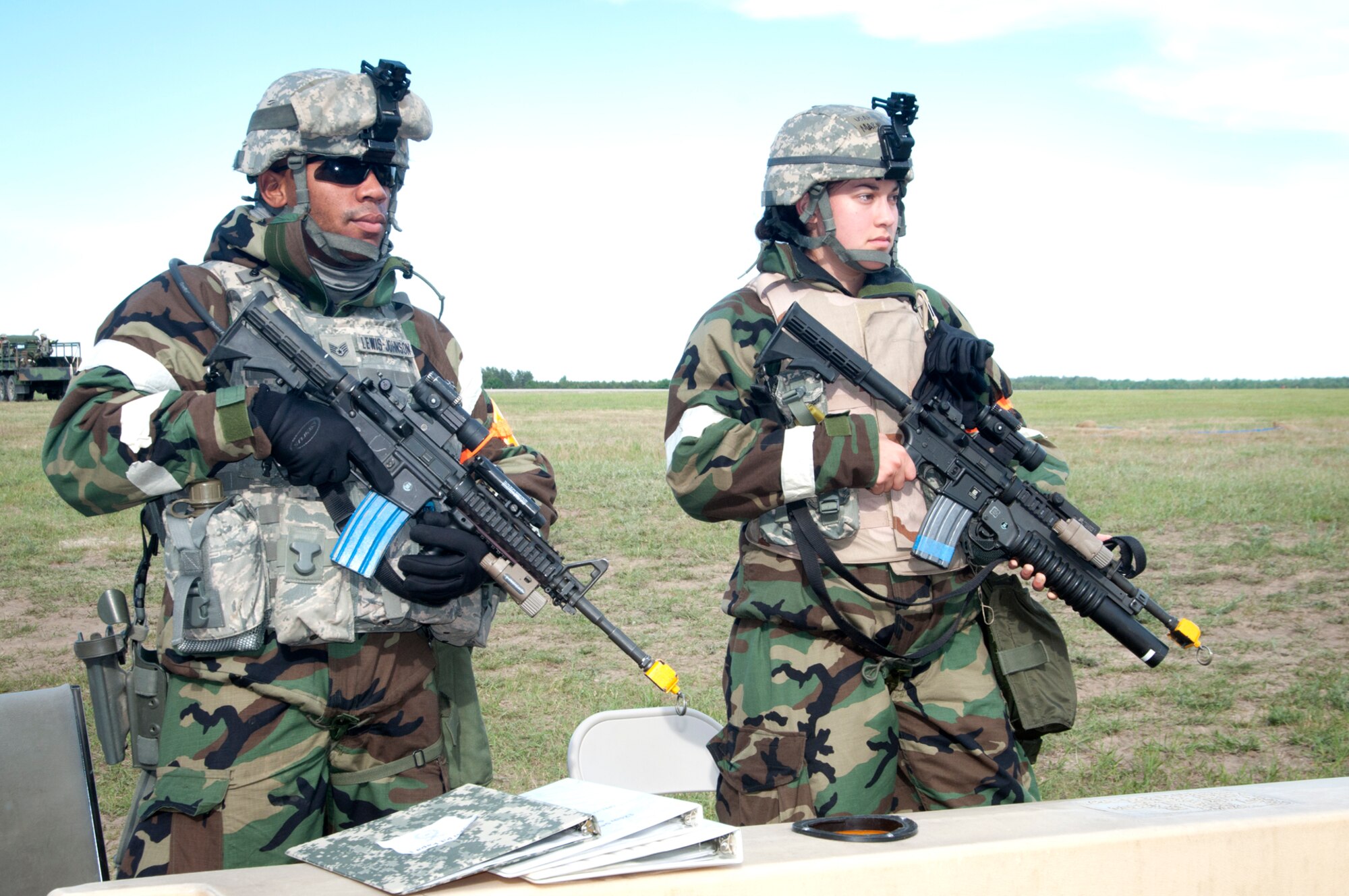 Airmen from the 459th Air Refueling Wing at Joint Base Andrews, Md., hold their weapons at port arms while providing security during an Operational Readiness Inspection, June 15. The 459 ARW deployed to Alpena, Mich., where they were evaluated and measured on their ability to perform wartime, contingency and force sustainment missions. (U.S. Air Force photo/ Tech. Sgt. Steve Lewis)