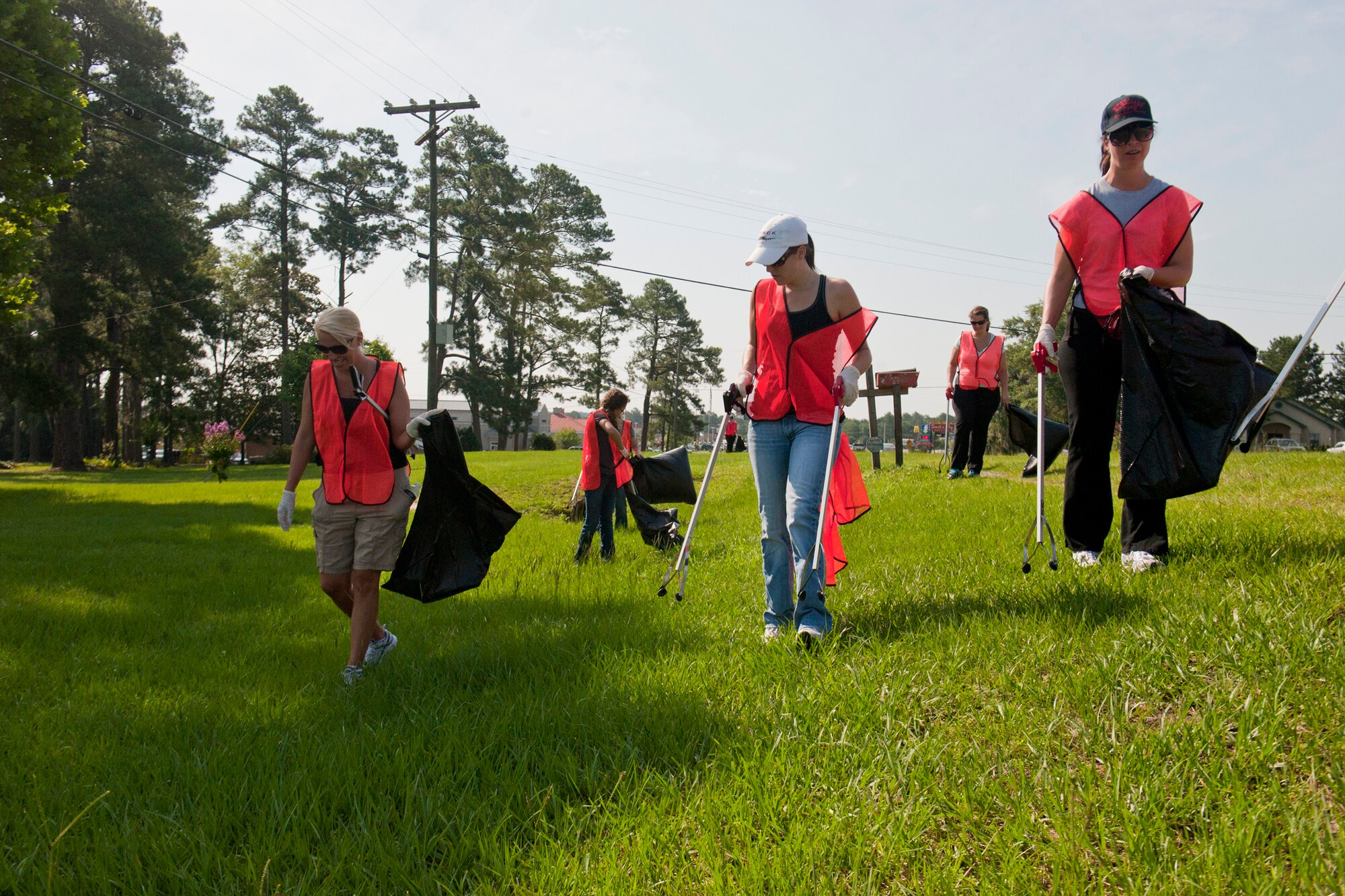 Members of the 75th Fighter Squadron Tiger Shark Spouses Group collect trash along Old Highway 41 South as part of an Adopt-A-Road program June 13, 2012, in Valdosta, Ga. Earlier this year, the group came up with the idea to adopt a highway after discussing ways of showing appreciation to the local community. (U.S. Air Force photo by Staff Sgt. Jamal D. Sutter/Released)