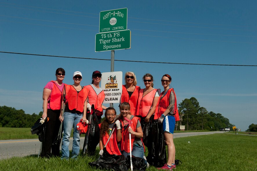 Members of the 75th Fighter Squadron Tiger Shark Spouses Group pose for a photo along Old Highway 41 South as part of an Adopt-A-Road program June 13, 2012, in Valdosta, Ga. Adopt-A-Road is a program sponsored by the Keep Lowndes/Valdosta Beautiful Commission to promote public involvement in keeping the city’s roads and streets beautiful and litter free. The group is responsible for approximately one mile of the highway. (U.S. Air Force photo by Staff Sgt. Jamal D. Sutter/Released) 