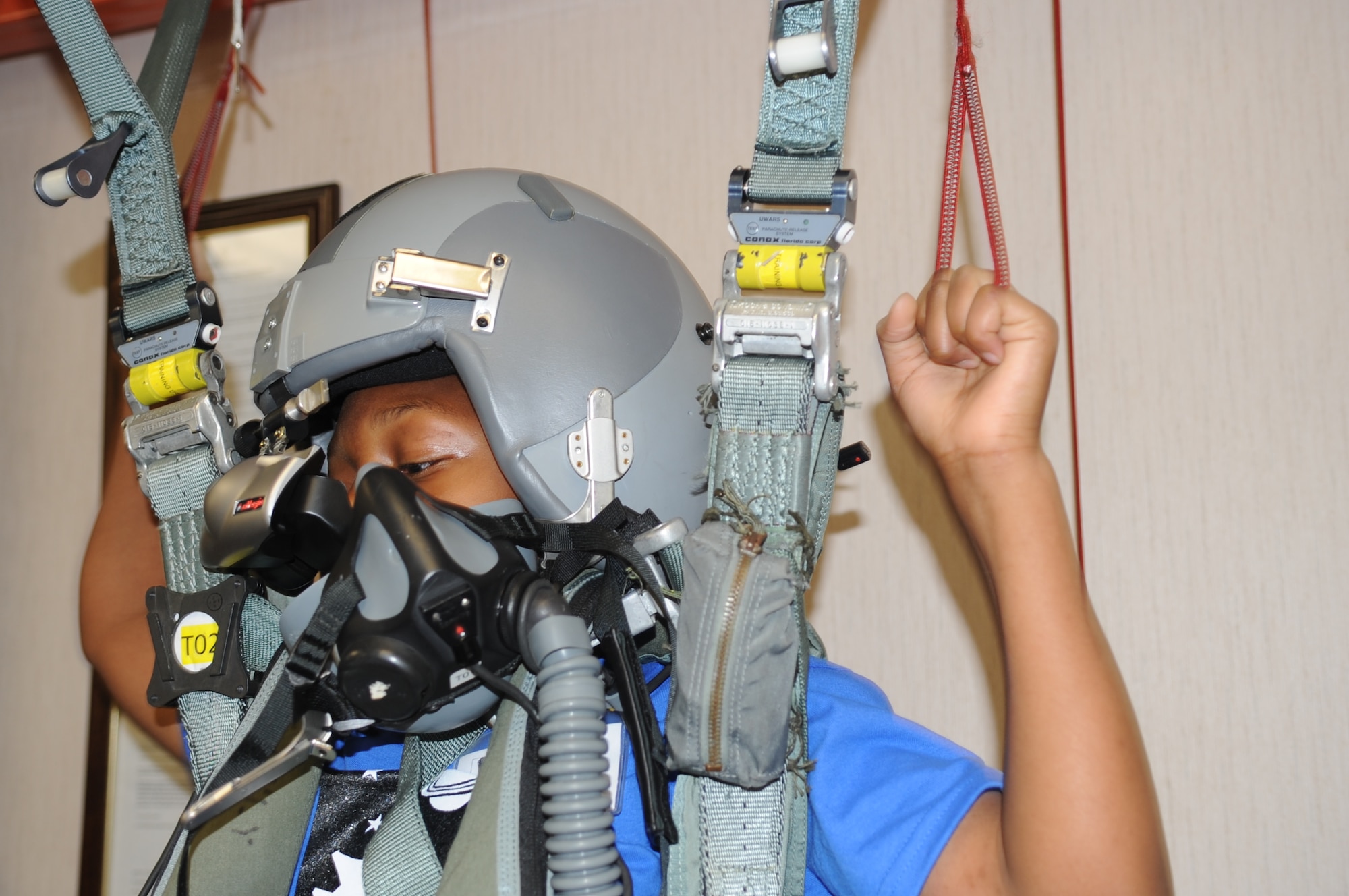 Khalil Copeland uses the parachute training simulator during a Science and Technology Academies Reinforcing Basic Aviation and Space Exploration tour on Seymour Johnson Air Force Base, N.C., June 18, 2012. Khalil had to land on the drop zone to complete the simulator training. Students competed with one another to see who could land the closest to the drop zone. Khalil is the son of U.S. Air Force Senior Airman Ebony Copeland, 916th Operations Support Squadron aircrew flight equipment journeyman, and hails from Goldsboro. (U.S. Air Force photo/Senior Airman Gino Reyes/Released)