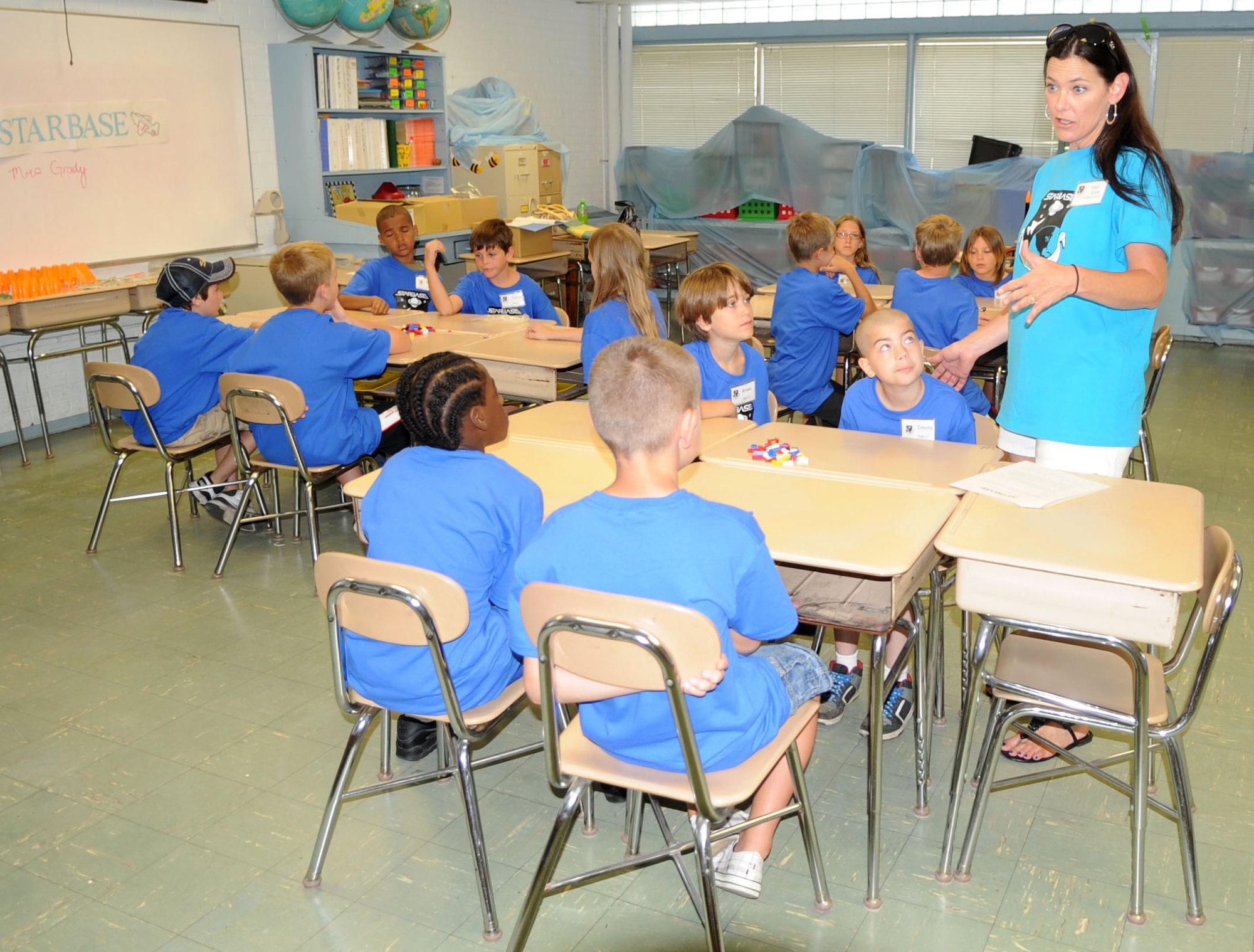 Science and Technology Academies Reinforcing Basic Aviation and Space Exploration teacher Tanya Grady explains the importance of teamwork at Meadow Lane Elementary school in Goldsboro, N.C., June 18, 2012. The students selected to participate in STARBASE learn about how the real world application of science and math principles. Grady hails from Goldsboro. (U.S. Air Force photo/Senior Airman Gino Reyes/Released)