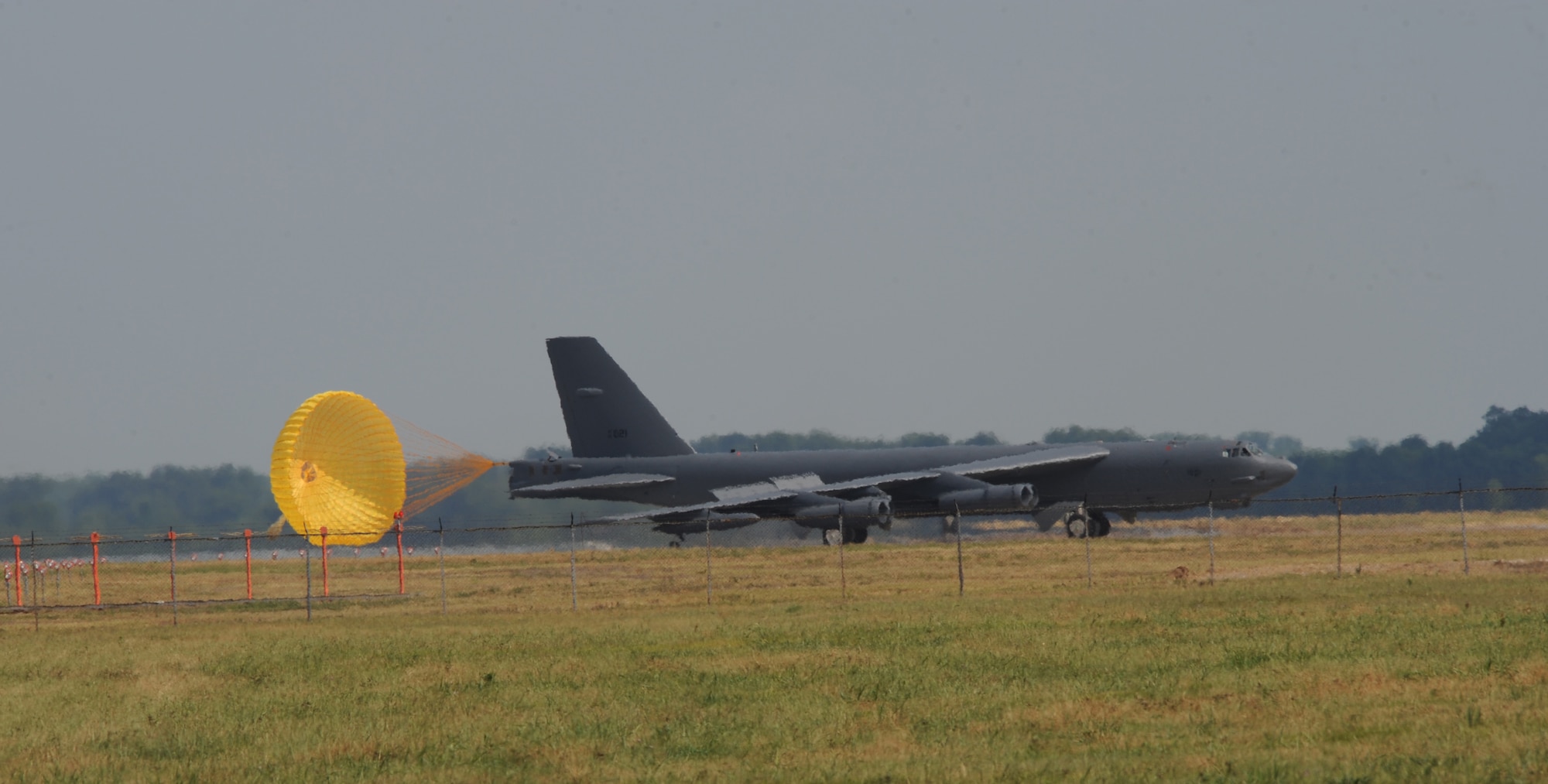 A B-52H Stratofortress deploys its drag parachute as it lands during an exercise on Barksdale Air Force Base, La., June 5. The parachute is used to slow down the aircraft as it lands. The 2nd Bomb Wing conducts training exercises to constantly refine and improve operational procedures and capabilities.  Realistic training during wing exercises is critical to the wing's ability to respond quickly and efficiently to real world situations, and is a vital part of Air Force readiness.  Wing Airmen train often to ensure base units are ready to fight any challenge, anywhere at anytime. (U.S. Air Force photo/Airman 1st Class Benjamin Gonsier)(RELEASED)