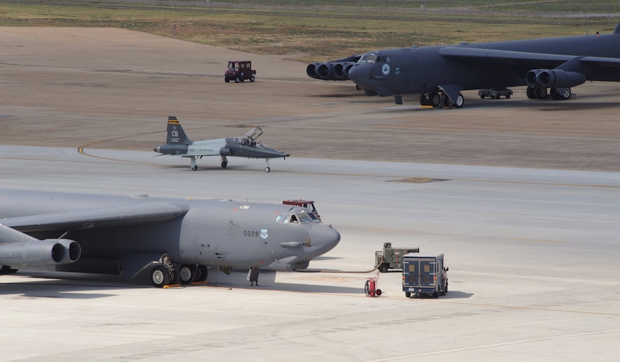 A T-38A Talon from Columbus Air Force Base, Miss., sit between two B-52H Stratofortress bombers during an exercise at Barksdale Air Force Base, La., June 5. Even when the 2nd Bomb Wing participates in an exercise, the transient alert team takes care of military and commercial aircraft that need refueling, emergency repairs and attention. (U.S. Air Force photo/Airman 1st Class Benjamin Gonsier)(RELEASED)
