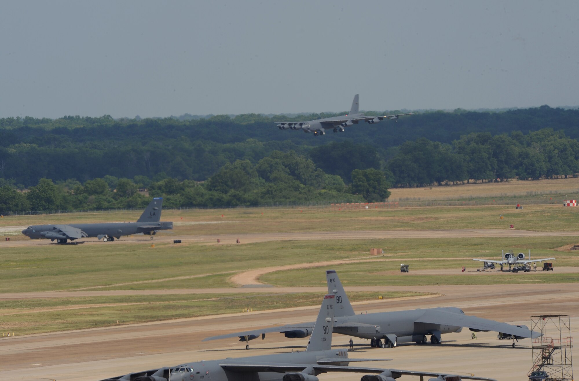 A B-52H Stratofortress prepares to perform a touch-and-go landing as another B-52H prepares to takeoff during an exercise at Barksdale Air Force Base, La., June 5. The exercise gave Airmen the opportunity to train for real world operations. (U.S. Air Force photo/Airman 1st Class Benjamin Gonsier)(RELEASED)