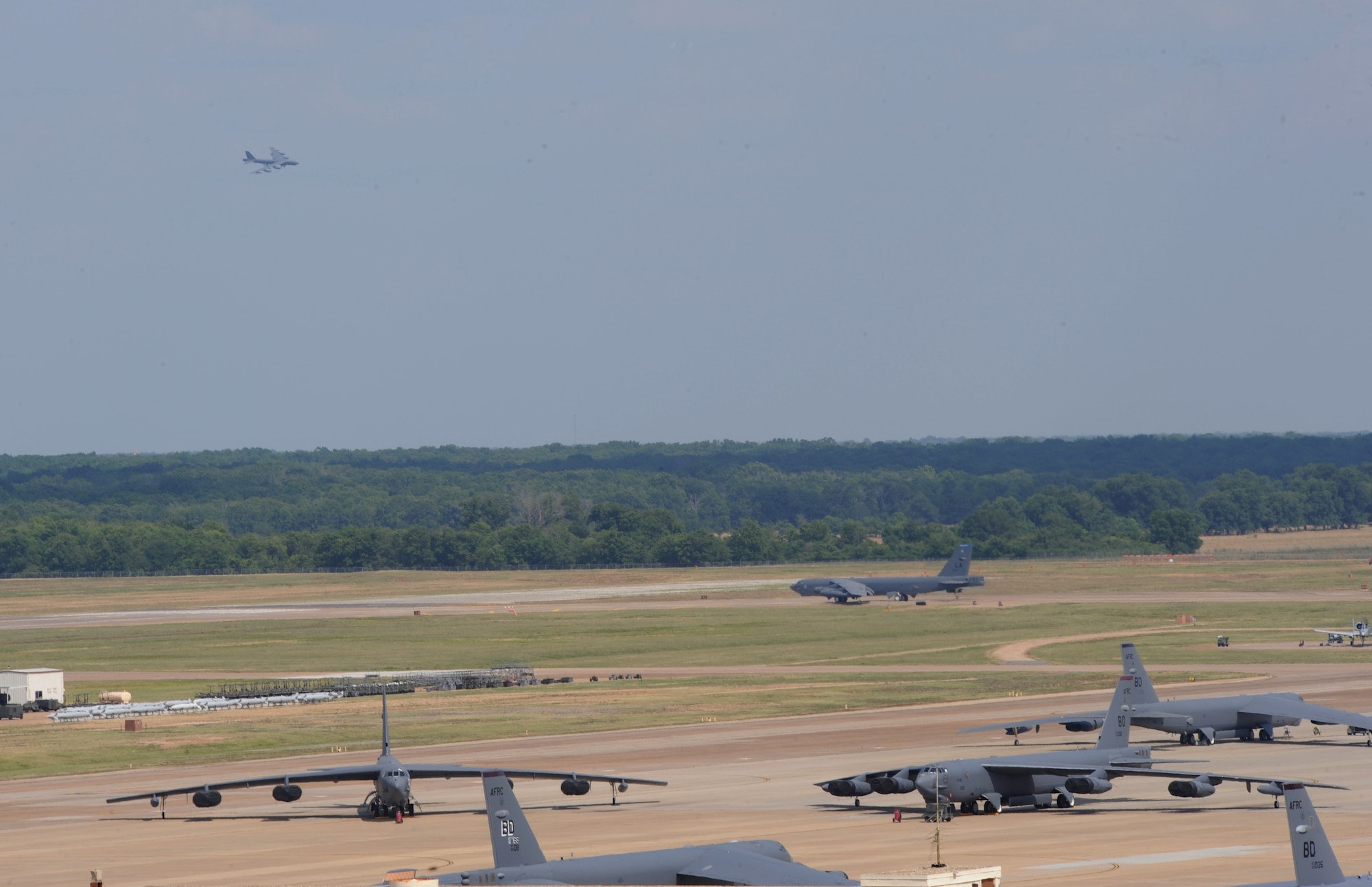 B-52H Stratofortress bombers fly, prepare to takeoff and sit on the flightline during an exercise at Barksdale Air Force Base, La., June 5. The 2nd Bomb Wing conducts training exercises to constantly refine and improve operational procedures and capabilities.  Realistic training during wing exercises is critical to the wing's ability to respond quickly and efficiently to real world situations, and is a vital part of Air Force readiness.  Wing Airmen train often to ensure base units are ready to fight any challenge, anywhere at anytime. (U.S. Air Force photo/Airman 1st Class Benjamin Gonsier)(RELEASED)