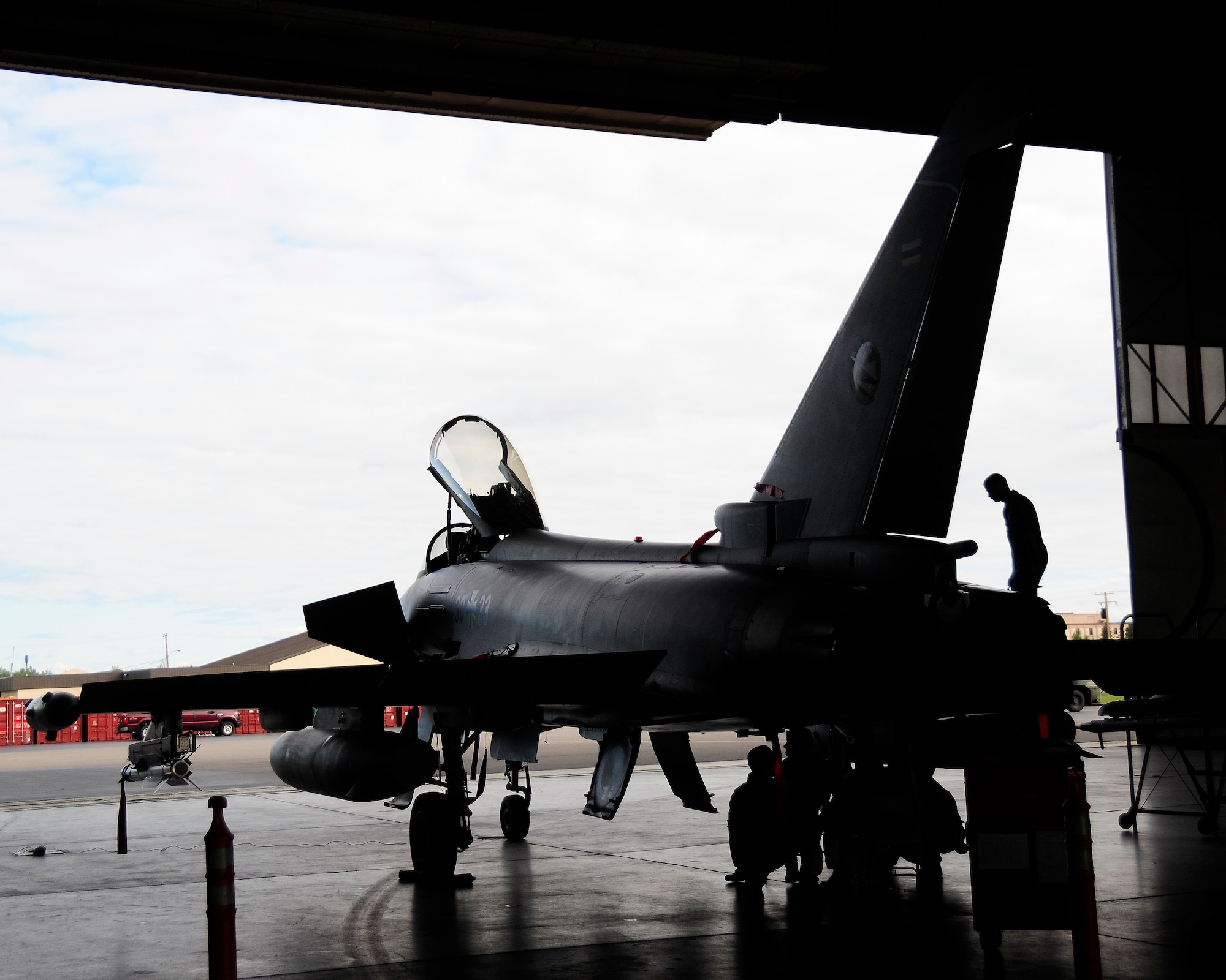 German air force maintainers inspect a German Eurofighter Typhoon upon its return from a flight during RED FLAG-Alaska 12-2, Eielson Air Force Base, Alaska. This is the first time the German Eurofighter has participated in a RF-A, as well as its first time on U.S. soil. (U.S. Air Force photo/Airman 1st Class Zachary Perras)