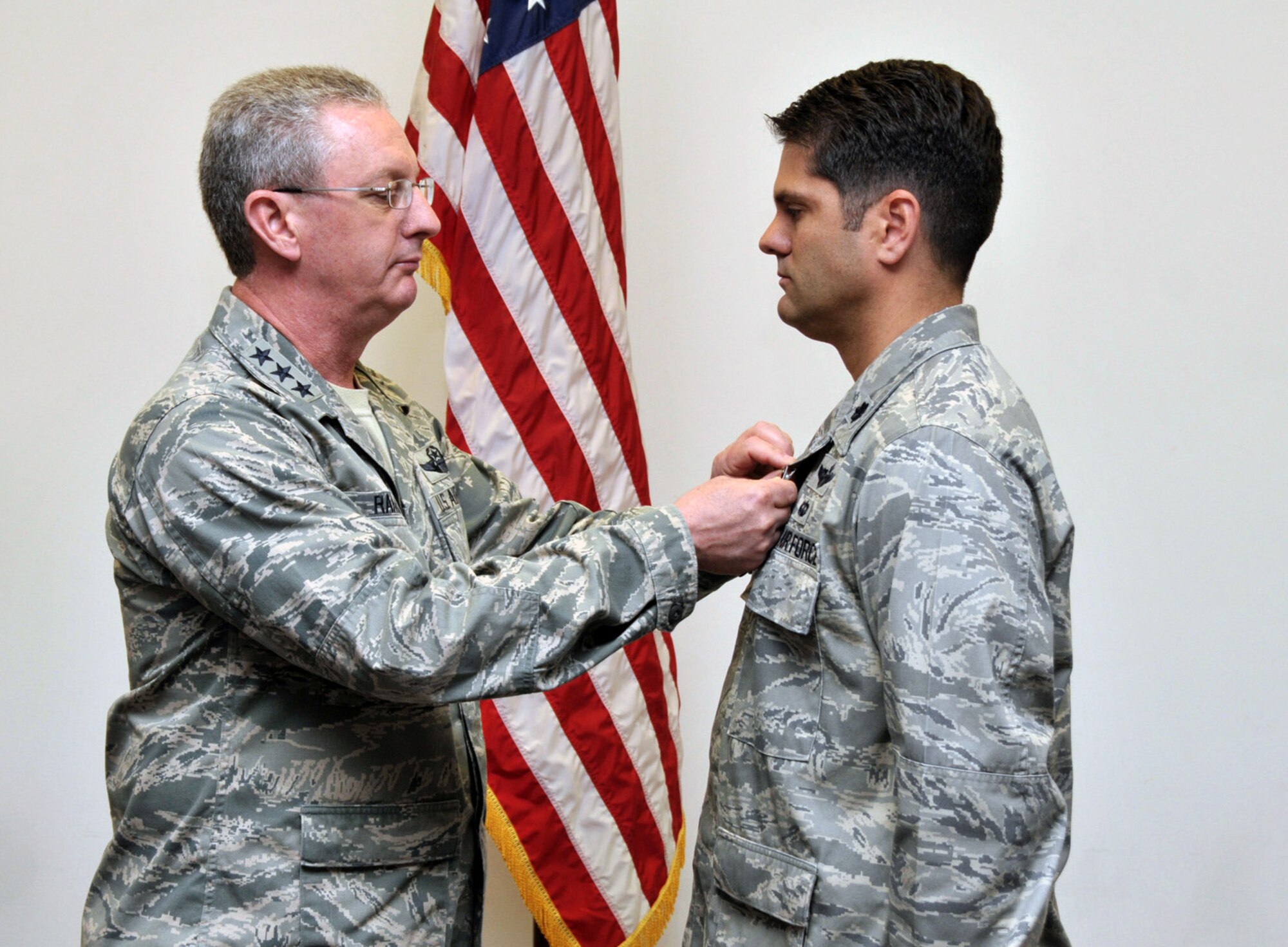 Lieutenant Col. Douglas Edwards, 906th Air Refueling Squadron commander, receives the Airman’s Medal from Lt. Gen. Mark Ramsay, 18th Air Force commander in a ceremony at Scott Air Force Base Ill., May 21, 2012.  Edwards received the award for rescuing an elderly woman from a burning vehicle on Nov. 2, 2009 near King Hill, Idaho.  Edwards succeeded in freeing the injured and trapped victim from her car just moments before the entire vehicle became engulfed in flames on the interstate.  Local Sheriff Deputies responded within eight minutes of the initial 9-1-1 call about the accident and later told Edwards the victim would have been burned alive if he hadn’t acted so quickly.  (U.S. Air Force photo by Master Sgt. Franklin Hayes)