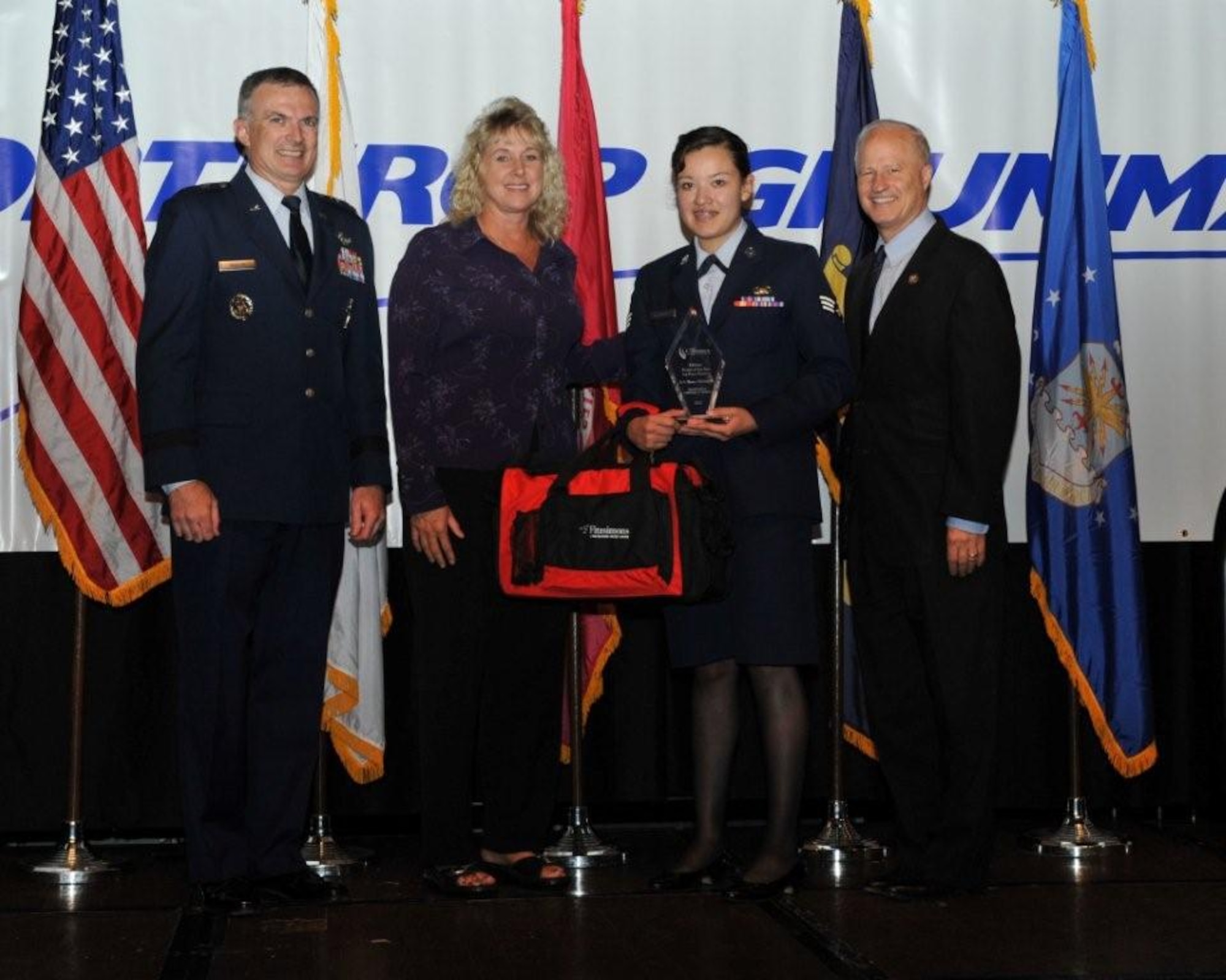 Maj. Gen. Martin Whelan, Director of Requirements, Headquarters Air Force Space Command, Peterson Air Force Base, Colo., Ms. Dana Rocha, the University of Phoenix, Military Division, Colorado Springs, Colo., Senior Airman Blanca Hernandez, Air Reserve Personnel Center, and Congressman Mr. Mike Coffman. U.S. House of Representatives, serving the 6th District of Colorado. Hernandez was recognized as the best in Colorado in the Air Force Reserve Category  at the Armed Forces Recognition luncheon June 15, 2012, in Denver. (Courtesy photo)