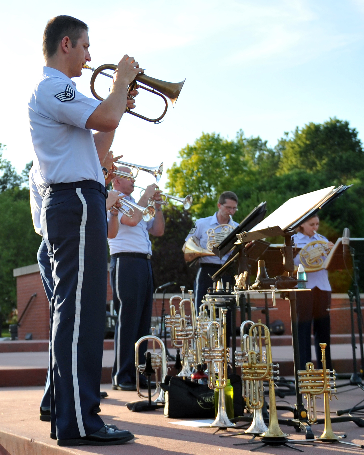 Musical director of Brass in Blue Staff Sergeant Carl Eitzen performs with the group - part of the Heartland of America Band's "Sunday's on Parade" concert series on the Offutt Air Force Base Parade Field