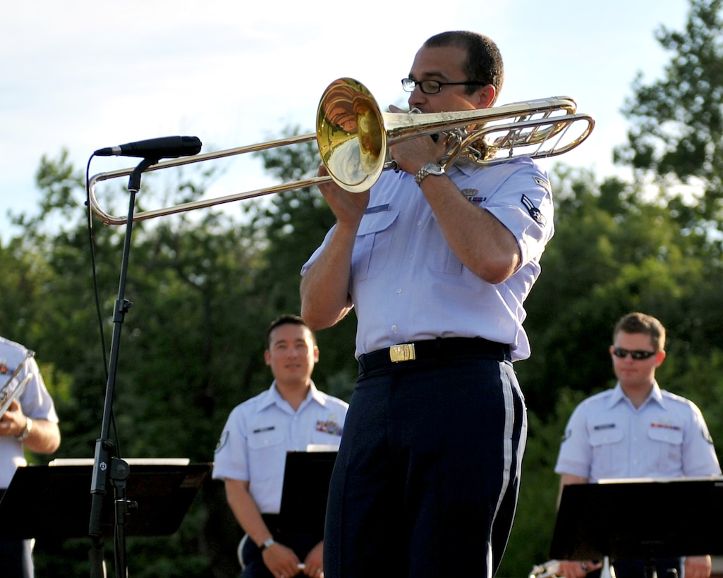 Airman First Class Benjamin Huseby is featured at a Brass in Blue performance - part of the Heartland of America Band's "Sunday's on Parade" concert series on the Offutt Air Force Base Parade Field