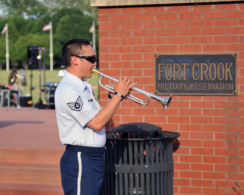 Staff Sergeant Patrick Brush warms up for a Brass in Blue performance - part of the Heartland of America Band's "Sunday's on Parade" concert series - on the Offutt Air Force Base Parade Field