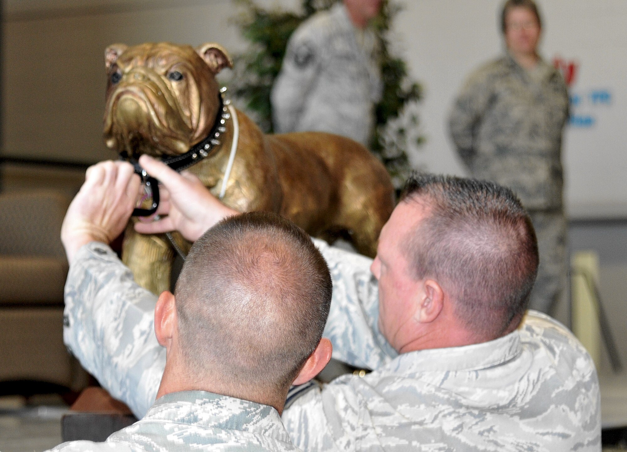 Members of the 27th Aerial Port Squadron, Minneapolis-St. Paul “leash the Dawg,” – relinquishing the Port Dawg trophy they won in 2010 – during the opening ceremonies of the 2012 Port Dawg Challenge at Dobbins Air Reserve Base, Ga., June 17-20, 2012. (U.S. Air Force photo/Master Sgt Chris Durney)