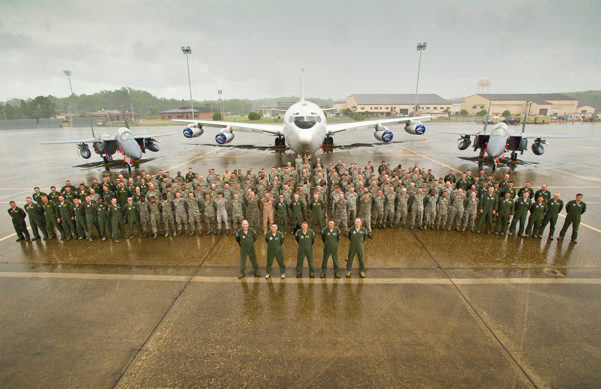 U.S. Air Force Airmen from the 116th and 461st Air Control Wings, Robins Air Force Base, Ga., and the 4th Fighter Wing, Seymour Johnson, N.C., pose for a photo in front of an E-8 Joint STARS and two F-15E Strike Eagles at Robins Air Force Base, Ga., June 10, 2012.  The 4th Fighter Wing was at Robins for the Iron Dagger exercise being hosted by Team JSTARS.   (National Guard photo by Master Sgt. Roger Parsons/Released)