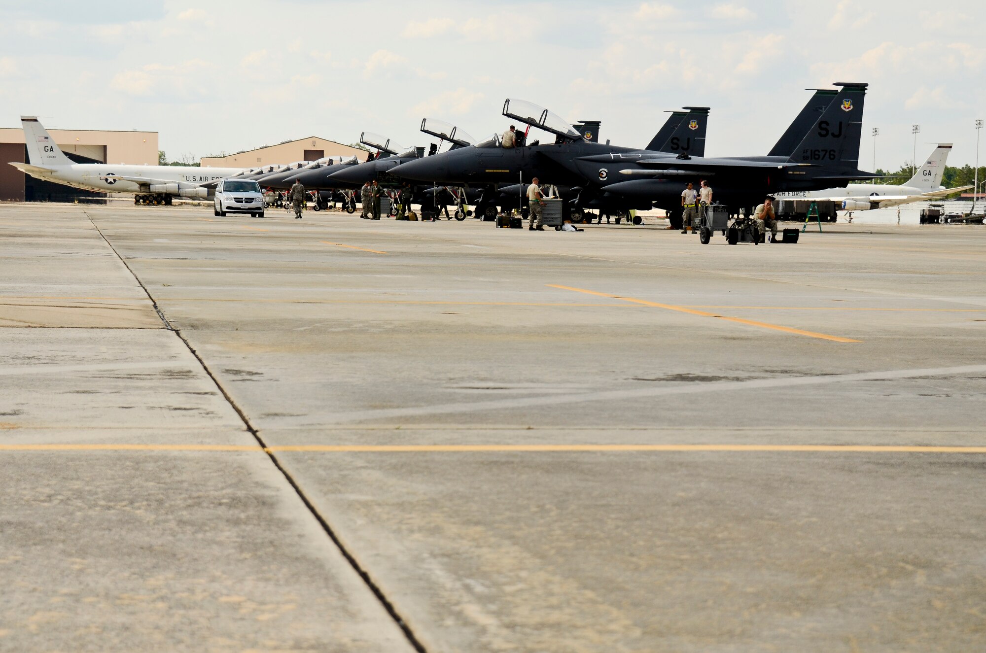 F-15E Strike Eagles from Seymour Johnson Air Force Base, N.C. are bedded down by crew chiefs on the flightline at Robins Air Force Base, Ga., June 8, 2012.  The Strike Eagles, sitting next to E-8 Joint STARS, were at Robins to participate in the JSTARS hosted Iron Dagger exercise.  (National Guard photo by Master Sgt. Roger Parsons/Released)