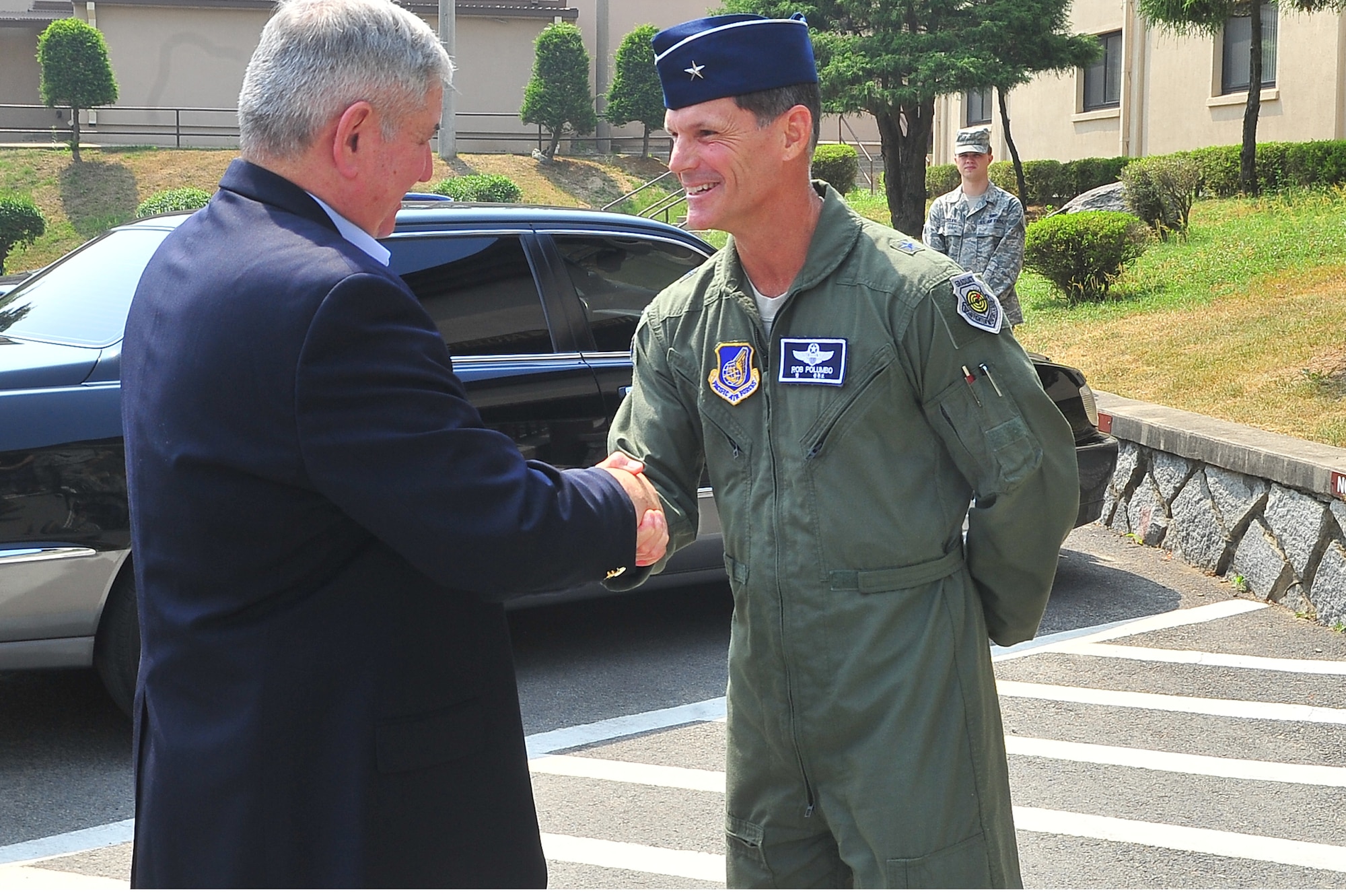 Former Chief of Staff of the Air Force, retired Gen. Ronald Fogleman, shakes hands with Brig. Gen. Robert Polumbo, 7th Air Force mobilization assistant to the commander, upon arrival to Osan Air Base, June 19, 2012. Fogleman spoke with Airmen as well as toured facilities during his visit. Fogleman also expressed his deepest gratitude toward Airmen serving in Korea during an all call with 25th Fighter Squadron Airmen. (U.S. Air Force photo/Senior Airman Adam Grant)