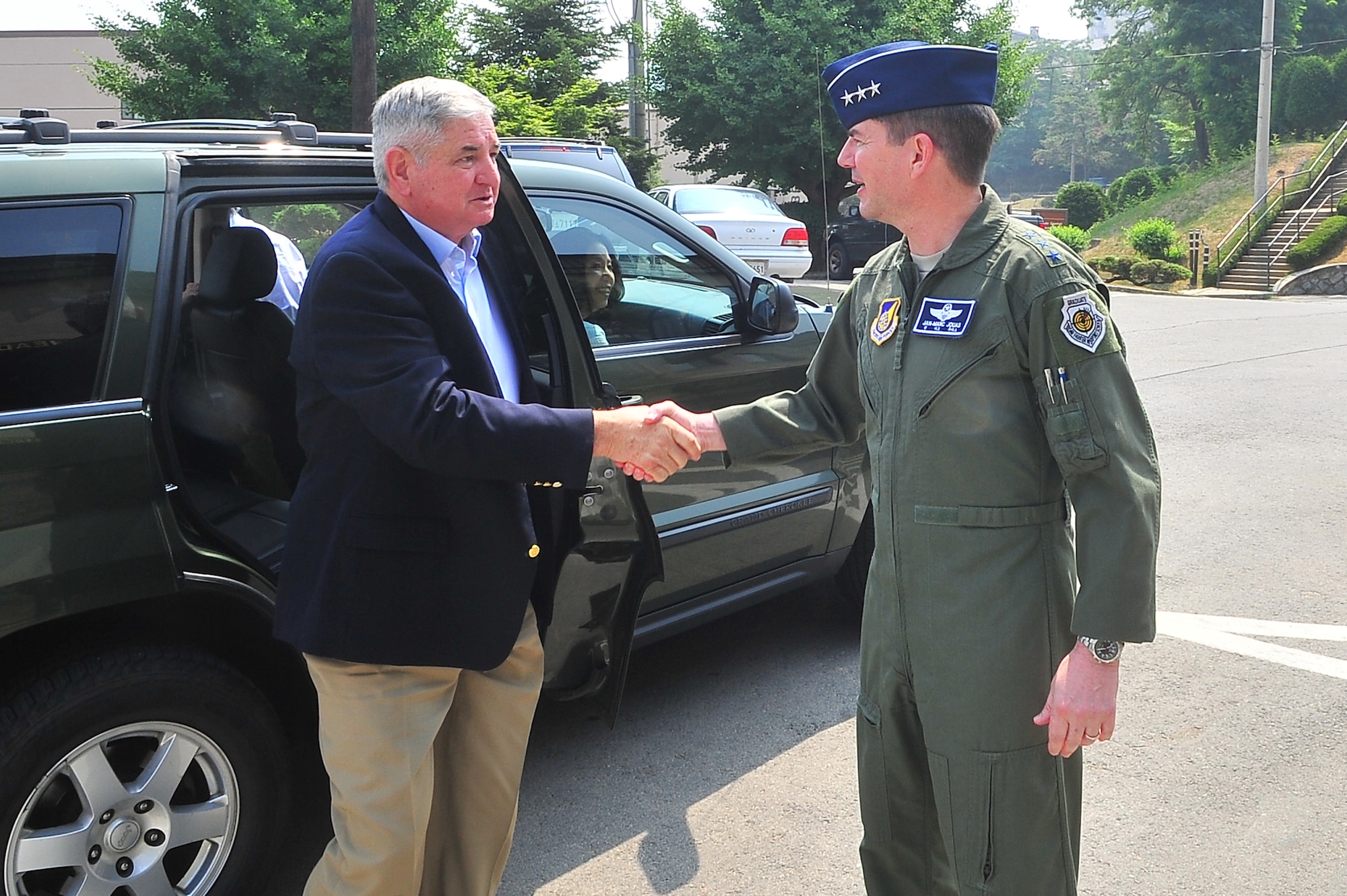 Retired Gen. Ronald Fogleman shakes hands with Lt. Gen. Jan-Marc Jouas, 7th Air Force commander, as he arrives to Osan Air Base, June 19, 2012. He served as 7th Air Force commander from July 1990 - August 1992 and was introduced to the current mission. During his visit he met with Airmen around base and thanked them for their service. (U.S. Air Force photo/Senior Airman Adam Grant)