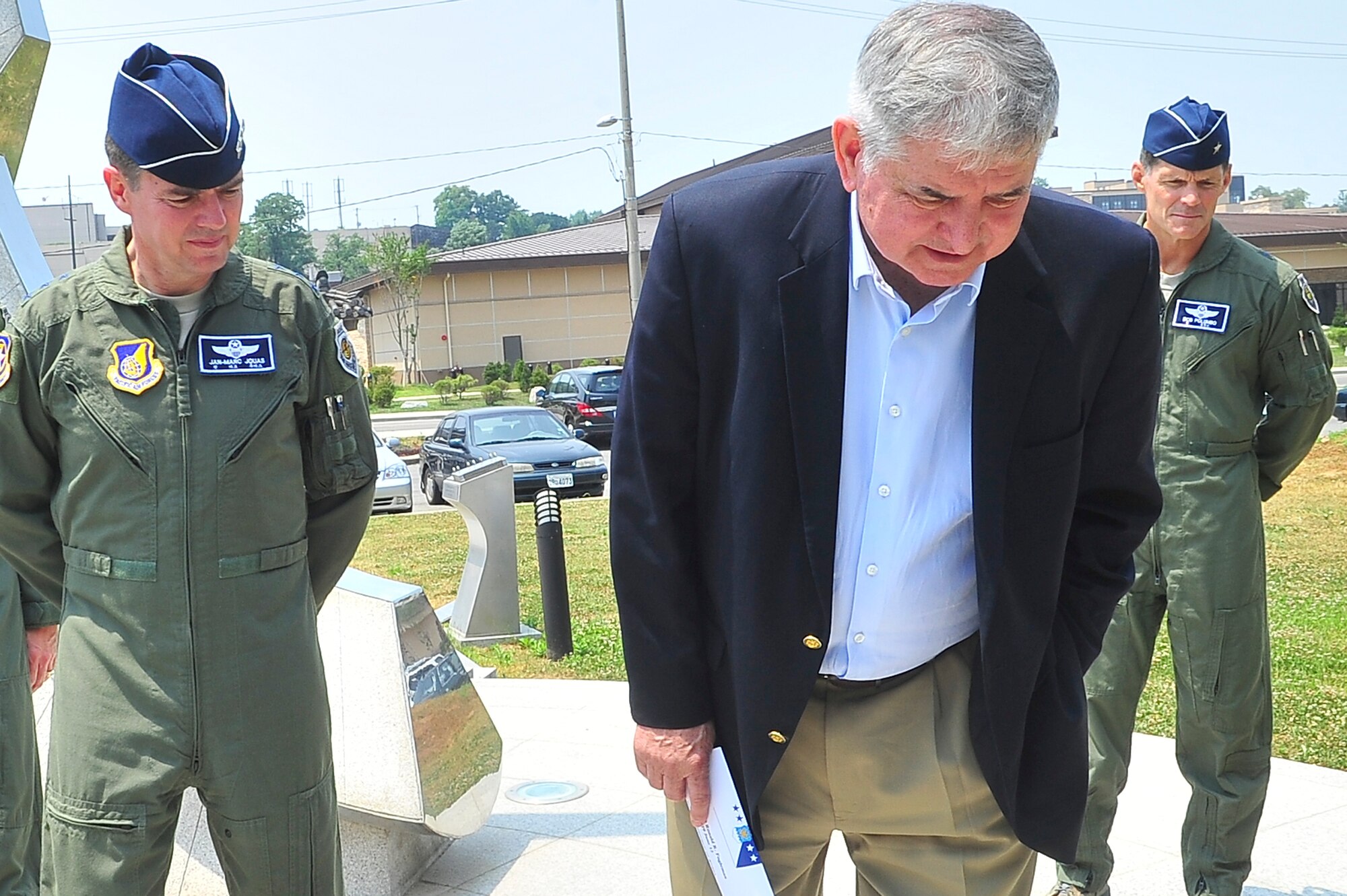 (Left) Lt. Gen. Marc Jouas, 7th Air Force commander, retired Gen. Ronald
Fogleman, and Brig. Gen. Robert Polumbo, 7th Air Force mobilization assistant to the commander, reviewed a memorial dedicated to Airmen outside of Turumi Lodge at Osan Air Base, June 19, 2012. Fogleman toured the base and made a stop to Osan after a two week trip to Tibet. Fogleman was the 15th Chief of Staff of the Air Force from 1994 to 1997. (U.S. Air Force photo/Senior Airman Adam Grant)
