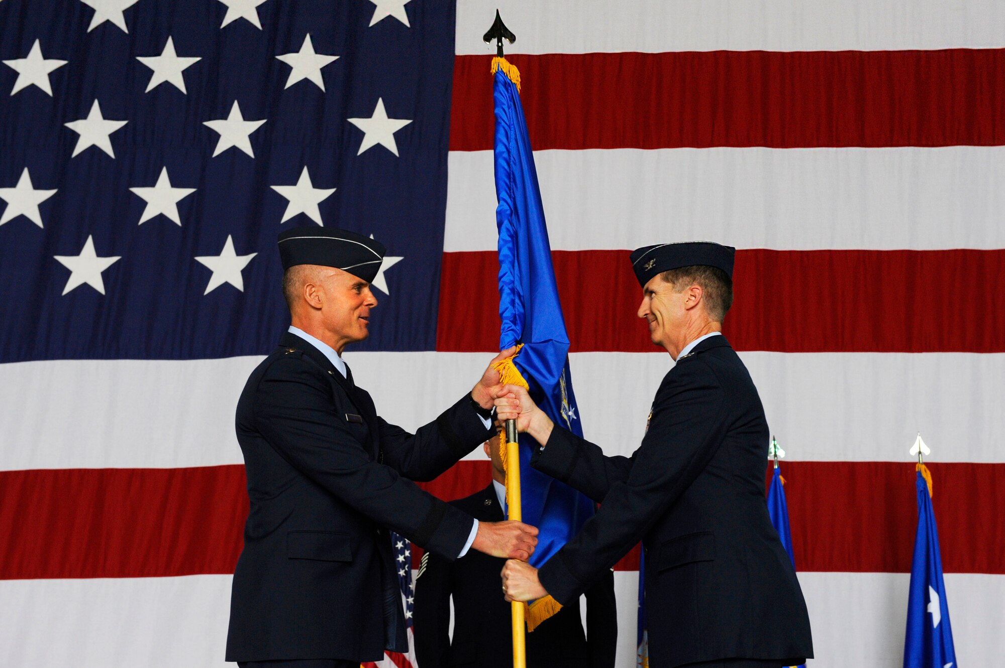 Lt. Gen. Craig Franklin, 3rd Air Force commander, gives command to Col. Jeffrey Marker, the new 603rd Air and Space Operation Center commander, during the 603rd AOC change of command on Ramstein Air Base, Germany, June 19, 2012. The 603rd AOC is the only Air Force unit of its kind that supports two combatant commands, for Europe and Africa. (U.S. Air Force photo/Senior Airman Aaron-Forrest Wainwright)