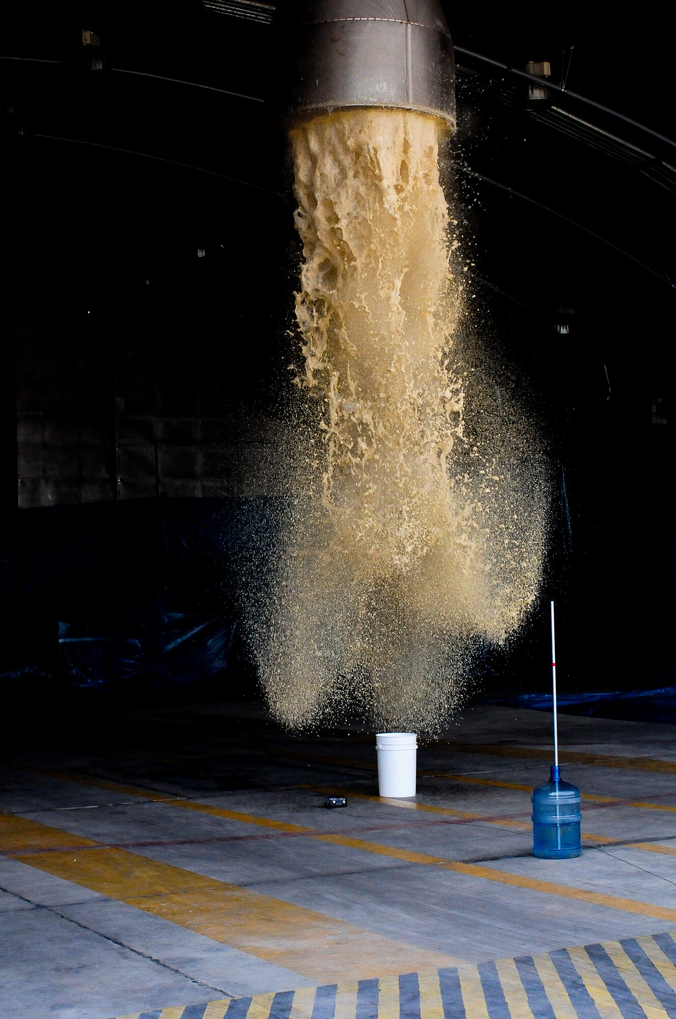 Tubes dispense fire suppressant foam in the 414th Expeditionary Reconnaissance Squadron hangar during the final test and certification of the new system that will protect the unit’s aircraft and equipment from fire damage June 15, 2012, at Incirlik Air Base, Turkey. The final test for certification required the foam to reach one meter in 4 minutes; the system took 50 seconds to meet the requirement. The new fire suppression system took three months to install and is part of a project to improve the facilities for the 414th ERS. (U.S. Air Force photo by Capt. Gina McKeen/Released)