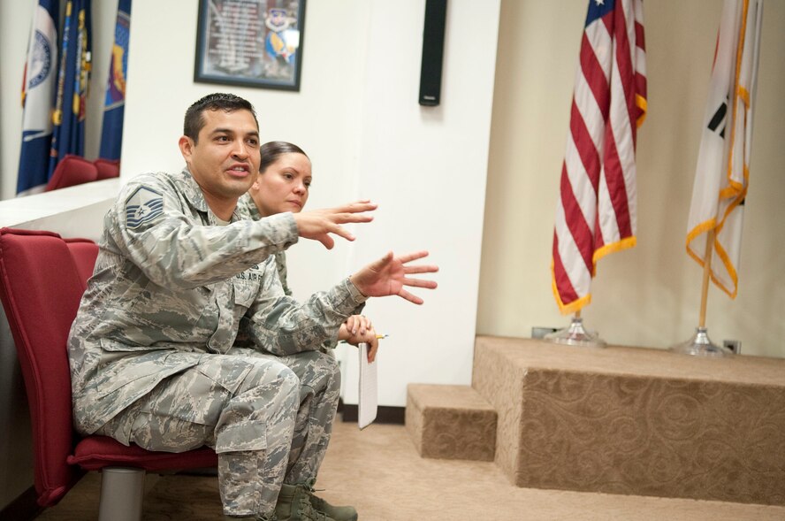 Master Sgt. Arturo Ayala, 8th Force Support Squadron installation personnel readiness superintendent, provides feedback to Airmen June 20, 2012, at Kunsan Air Base, Republic of Korea, after their impromptu speeches. The Toastmasters-style meeting helped Airmen finesse their public speaking skills. (U.S. Air Force photo/Senior Airman Brigitte N. Brantley)