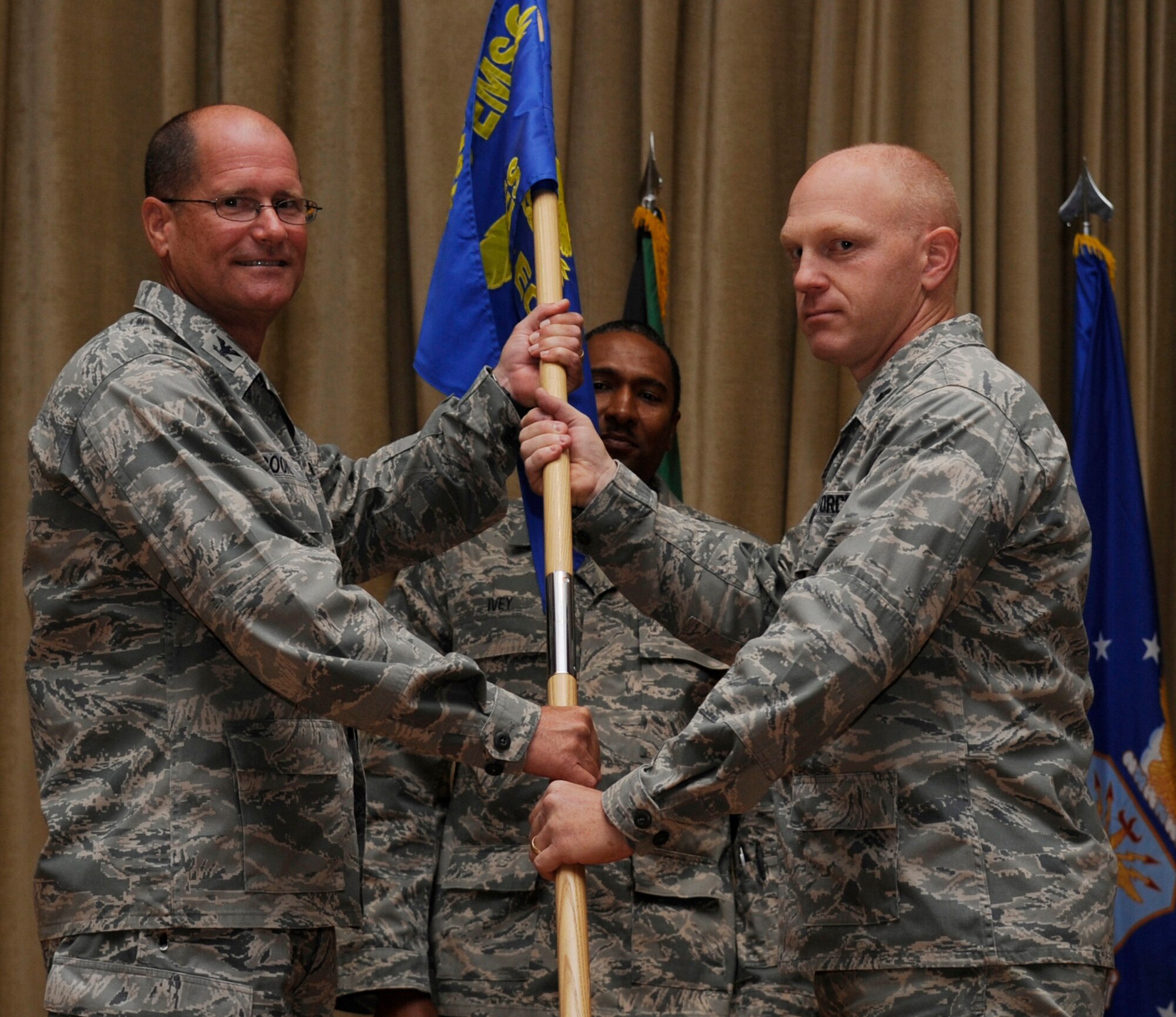 SOUTHWEST ASIA - Col. Richard Poore, 386th Mission Support Group commander, gives the 386th Expeditionary Civil Engineer Squadron guideon to Lt. Col. Kyle Brown, during the change of command ceremony here June 19, 2012. (U.S. Air Force photo/Staff Sgt. Alexandra M. Boutte) 