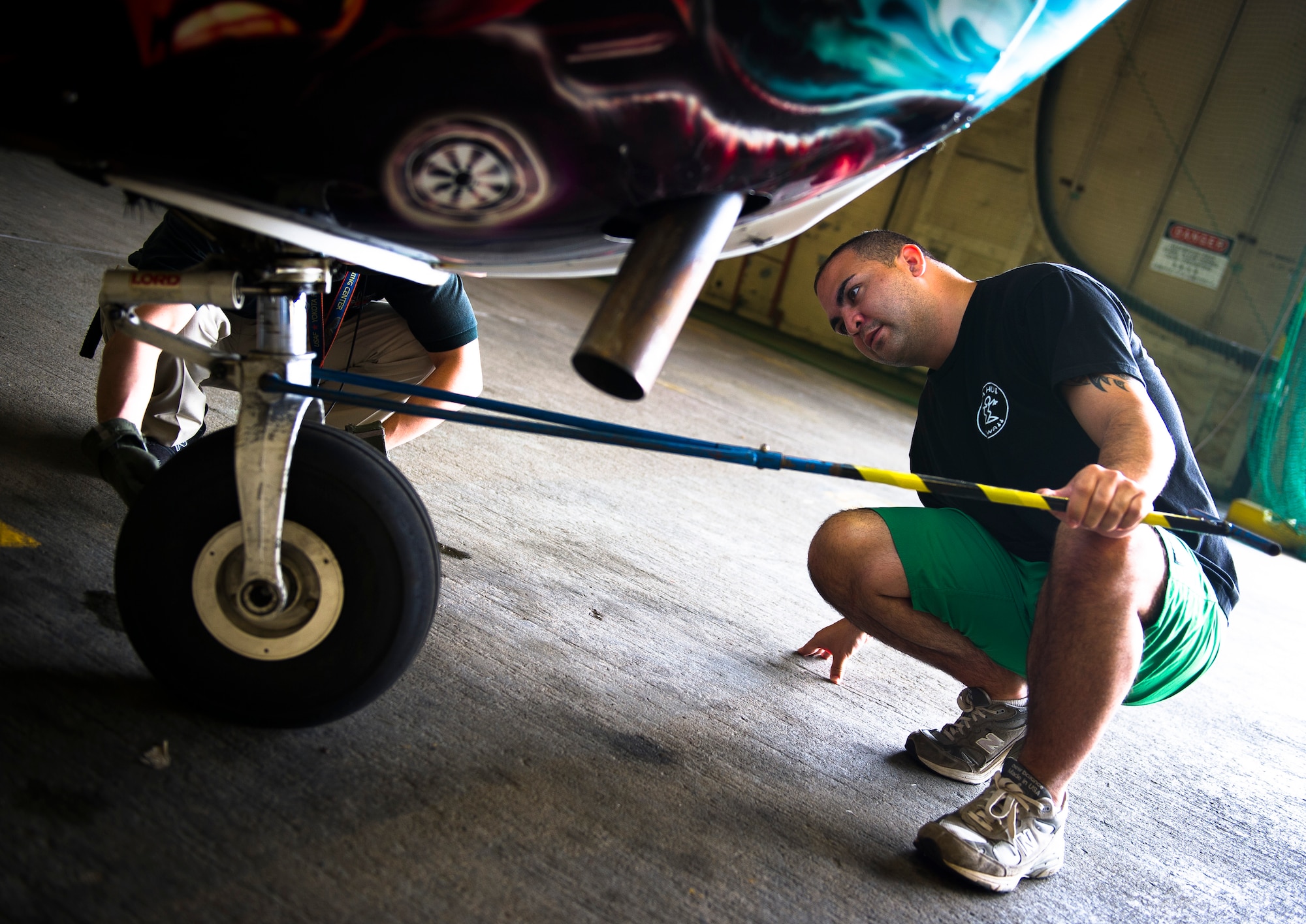 YOKOTA AIR BASE, Japan -- Staff Sgt. Galen Apo, student pilot from the 374th Maintenance Squadron, attaches a tow rod to a Cessna 172 prior to performing pre-flight checks on Yokota Air Base, Japan, June 15, 2012. Pre-flight checks for a student pilot take approximately 30 minutes to an hour depending on the student's knowledge level. (U.S. Air Force photo by Staff Sgt. Chad C. Strohmeyer)