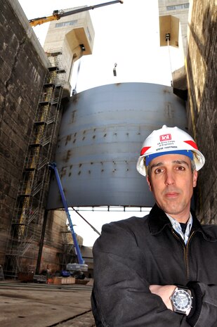 District Project Manager Steve Hartman stands in front of the newly replaced navigation lock gate replacement in March 2011. 