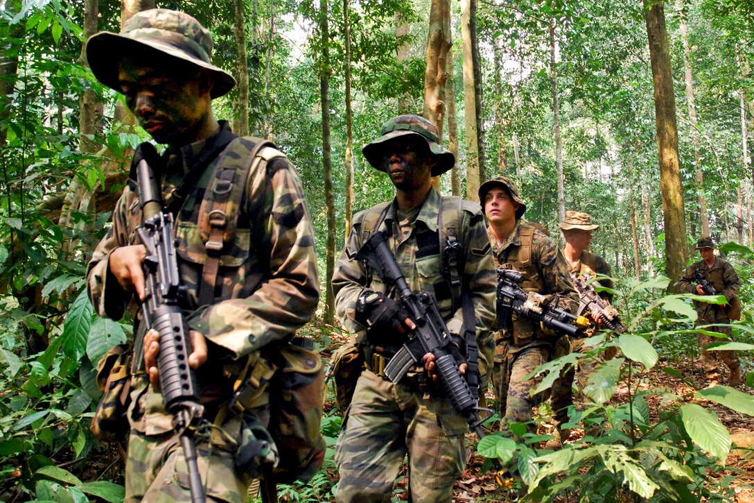 U.S. Marines and Malaysian soldiers conduct an ambush exercise during Cooperation Afloat Readiness and Training Malaysia 2012 in Beraus, Malaysia, June 17, 2012. The bilateral military exercises occur between the U.S. Navy and the armed forces of Bangladesh, Brunei, Cambodia, Indonesia, Malaysia, the Philippines, Singapore, and Thailand. Timor Leste joined the exercise for the first time this year. 