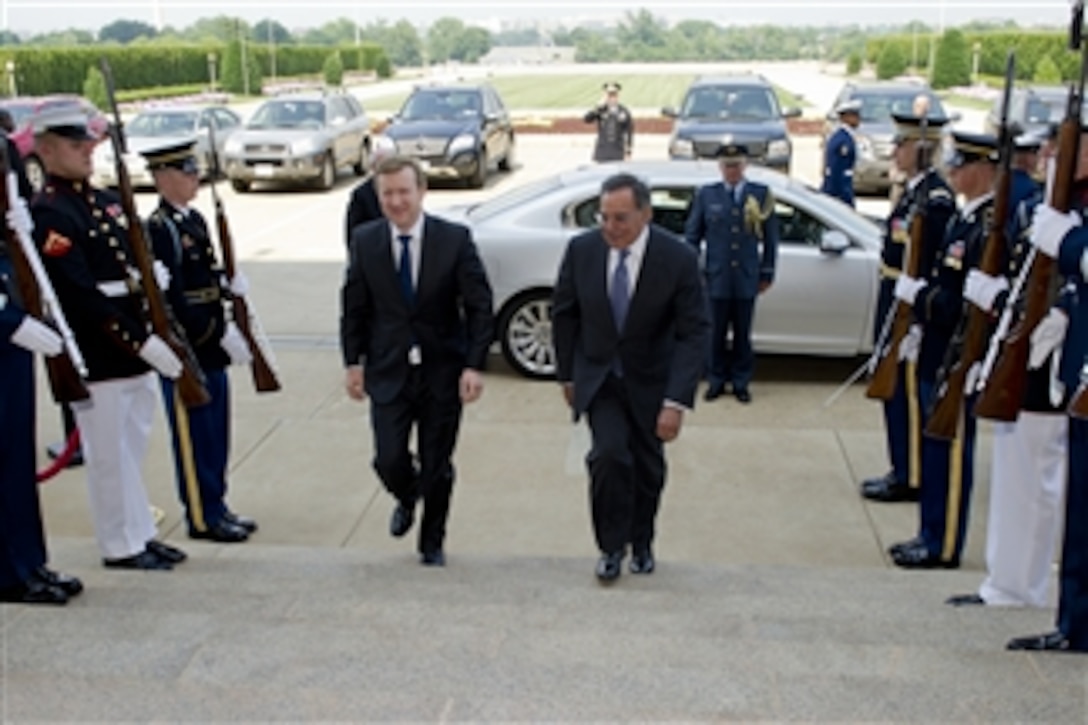 Secretary of Defense Leon E. Panetta escorts New Zealand's Minister of Defense Jonathan Coleman through an honor cordon and into the Pentagon, on June 19, 2012.  Panetta and Coleman will meet briefly before signing a Memorandum of Understanding defining the strategic vision for defense cooperation in the two countries bi-lateral relationship.  