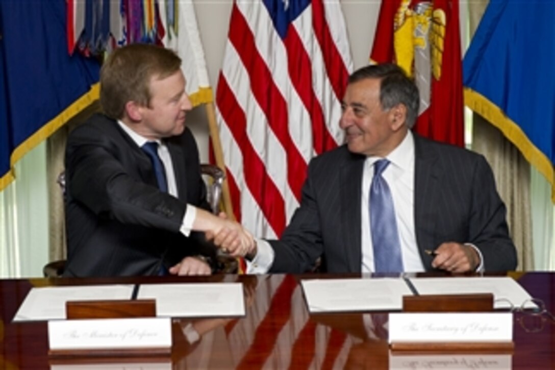 Secretary of Defense Leon E. Panetta, right, and New Zealand's Minister of Defense Jonathan Coleman shake hands after signing a Memorandum of Understanding defining the strategic vision for defense cooperation in the two countries bi-lateral relationship at the Pentagon on June 19, 2012.  