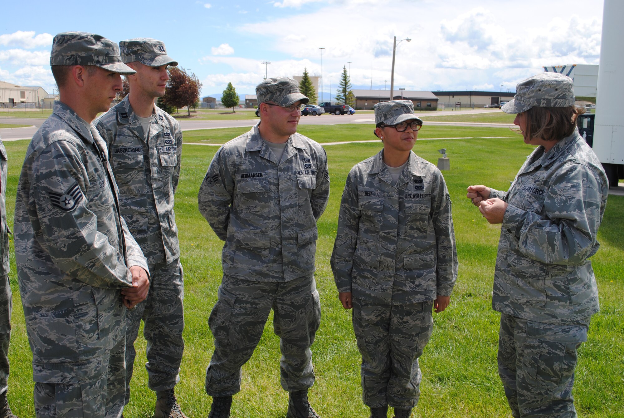 Members of the 341st CES emergency management team listen as Col. Angela Stout, 341st Mission Support Group commander, far right, addresses them on the importance of the recent StormReady® certification during a sign-posting ceremony June 8.  The base was certified May 3. (U.S. Air Force photo/Airman 1st Class Cortney Paxton)