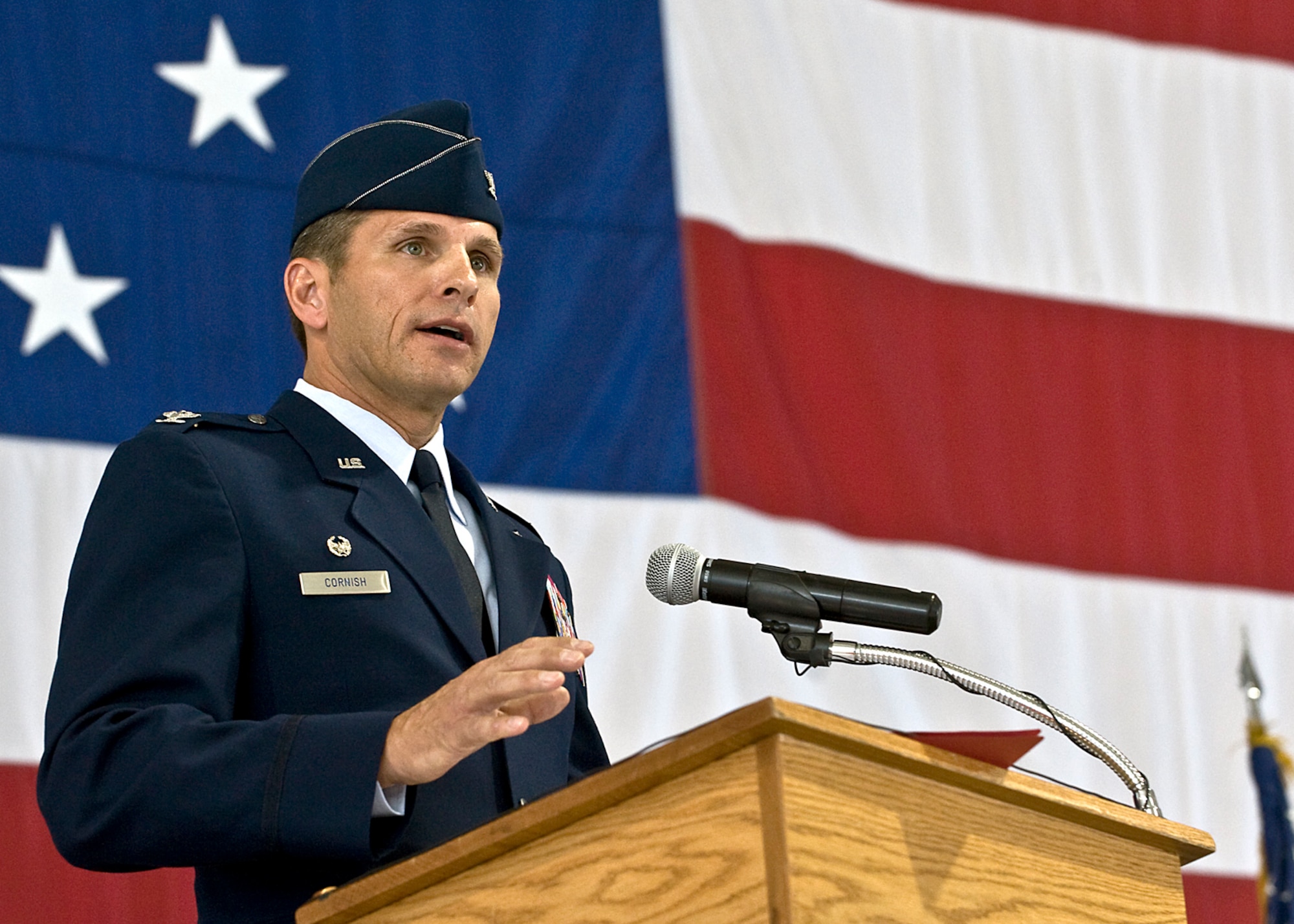 Col. Barry Cornish, 99th Air Base Wing commander, speaks to Airmen and invited guests after accepting command of the 99th Air Base Wing June 15, 2012, at Nellis Air Force Base, Nev. Prior to assuming command of the 99th ABW, Cornish was vice commander of Nellis' 57th Wing. (U.S. Air Force photo by Staff Sgt. Christopher Hubenthal)