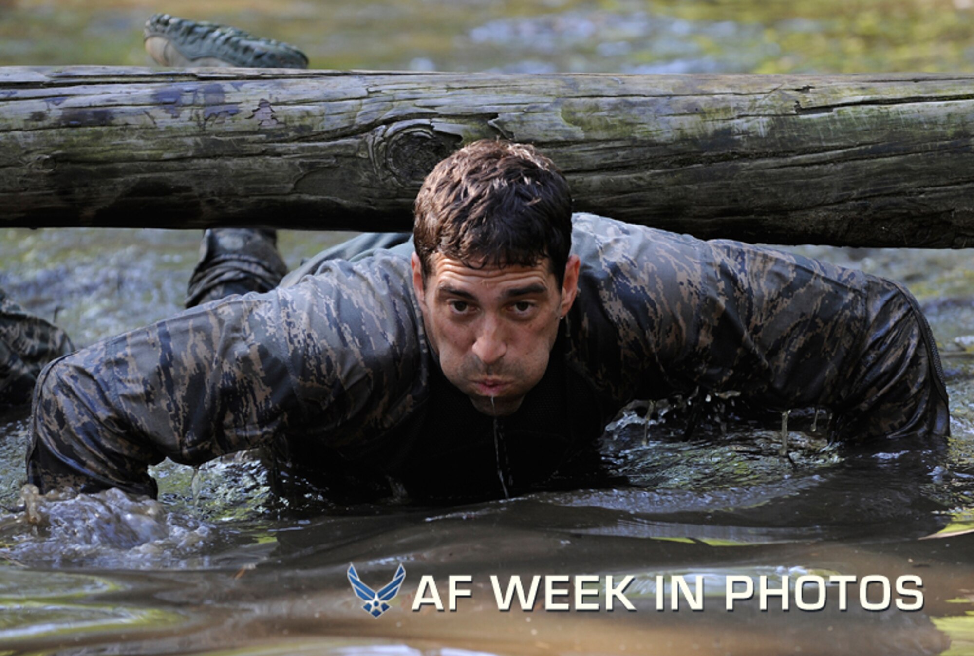 Maj. Christopher Wright navigates through a water obstacle during a combat mission readiness evaluation the Pre-Ranger Course at Fort Bragg, N.C., June 14, 2012. Wright is the director of operations of the 14th Air Support Operations Squadron at Pope Field, N.C. (U.S. Air Force photo/Val Gempis)