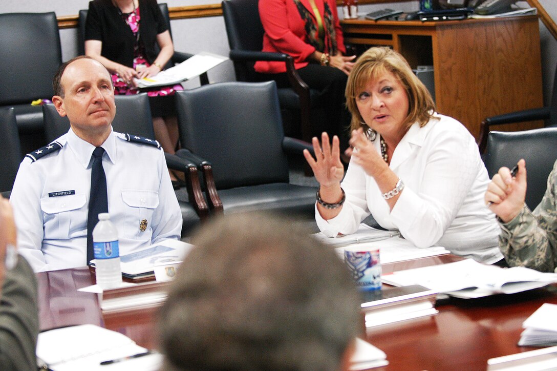 Maj. Gen. Bruce Litchfield, Oklahoma City Air Logistics Center commander, Tinker Air Force Base, listens to Bonnie Jones, 638th Supply Chain Management Group director, during a briefing while at Robins. Gen. Litchfield will be the incoming AirForce Sustainment Center commander. (U. S. Air Force photo/ Sue Sapp)