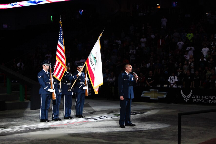 Major Deric Prescott, March Air Reserve Base JAG, sings the National Anthem
while the Blue Eagles Total Force Honor Guard presents the colors at the Air Force
Reserve Command’s Street League Skateboarding recruiting event on June 15 at
the Citizens Business Bank Arena in Ontario. They also performed at the semifinal
event the next day. Skatingboarding professional and television reality star Rob
Dyrdek attended the event along with other well known skateboarders. (U.S. Air Force photo)