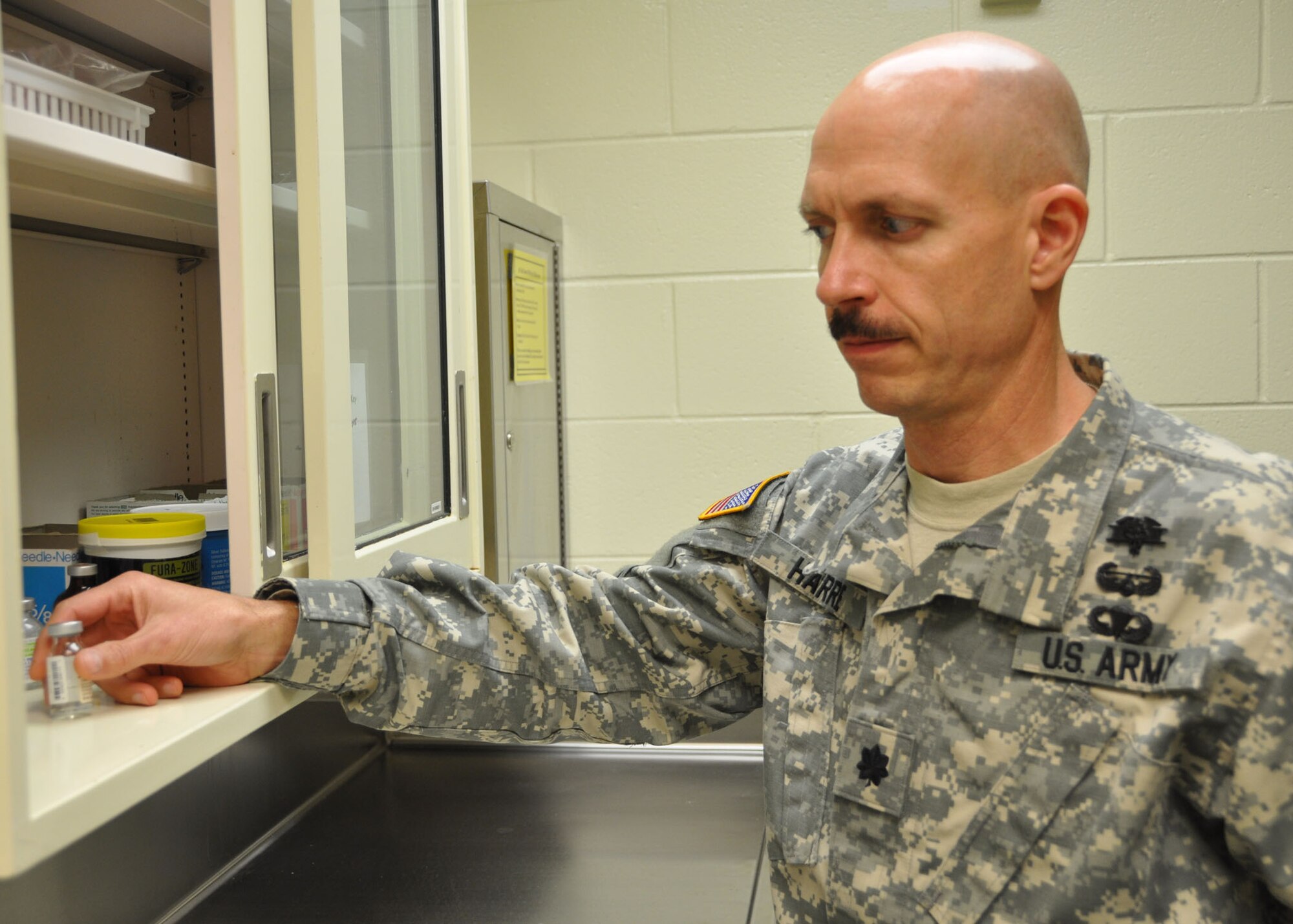 Army veterinarian Lt. Col. (Dr.) Joseph Harre, chief of veterinary resources with the 81st Medical Support Squadron’s Clinical Research Laboratory, checks a vial of medication June 13, 2012, at Keesler Air Force Base, Miss.  (U.S. Air Force photo by Steve Pivnick)