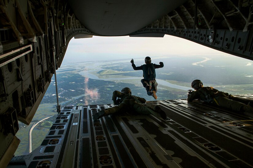 A member of the 'Wings of Blue' skydiving team from the U.S. Air Force Academy  jumps out of a C-17A Globemaster III over Joseph P. Riley, Jr. Stadium in Charleston, S.C., before the South Atlantic League All-Star game, June 19, 2012. The jump team parachuted in with the ball for the opening pitch of the all-star game. (U.S. Air Force photo by Airman 1st Class George Goslin)