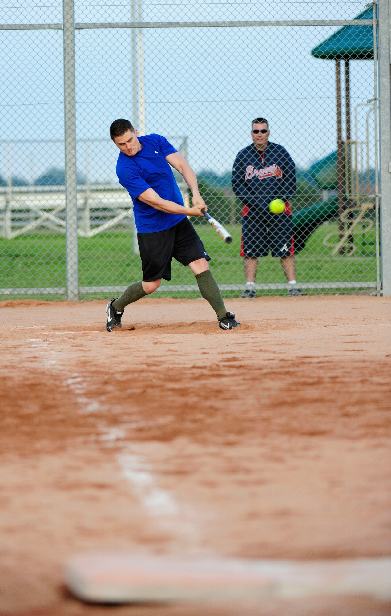 RAF MILDENHALL, England – Matthew St Onge, 100th Aircraft Maintenance Squadron, bats during an intramural softball game against the 100th Communications Squadron at RAF Mildenhall June 20, 2012. The intramural softball league is composed of 12 teams from various squadrons around base. (U.S. Air Force photo/Senior Airman Ethan Morgan)