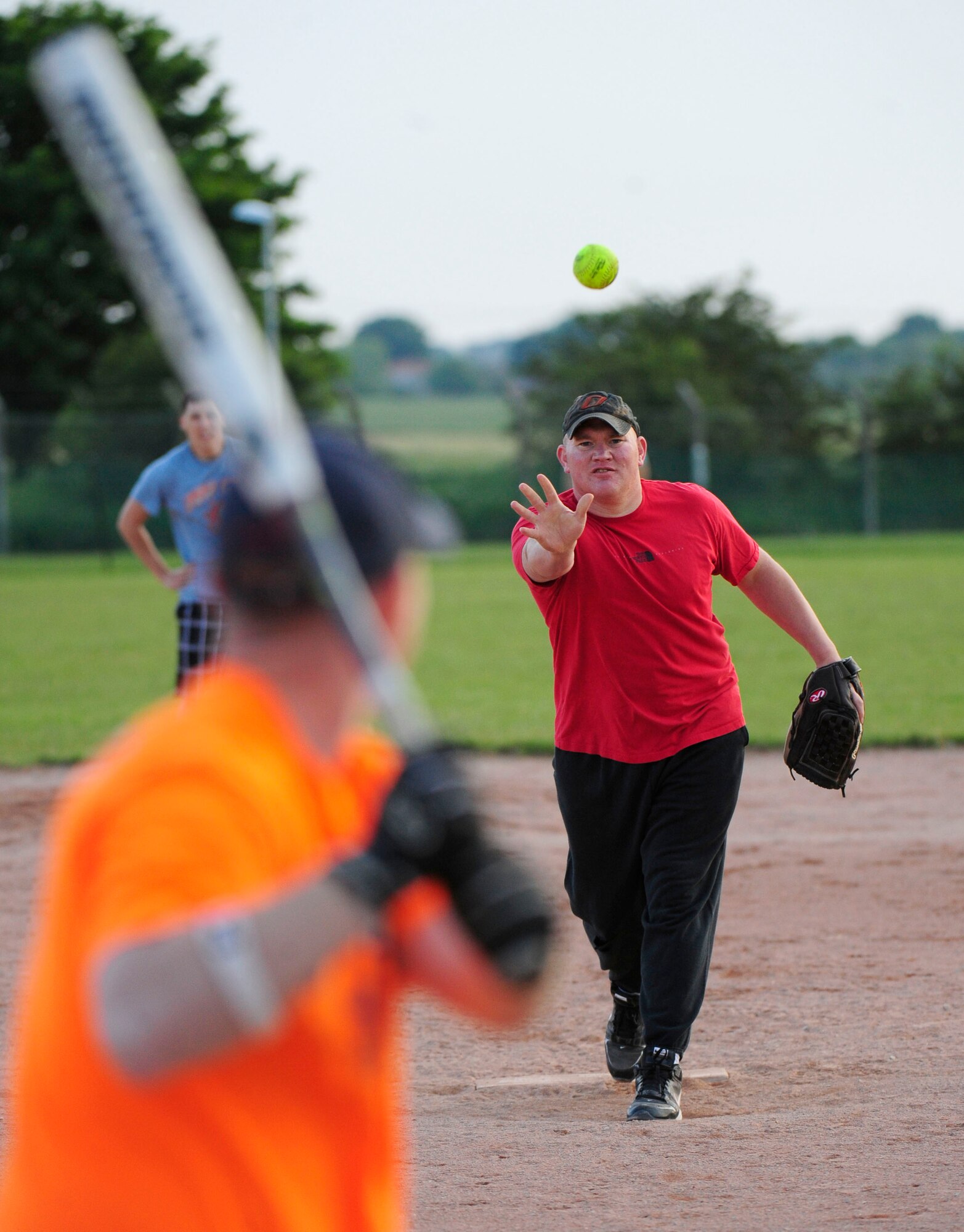 RAF MILDENHALL, England – Austin "Tank" Meyer, 100th Aircraft Maintenance Squadron, pitches against an Airman from the 100th Communications Squadron during an intramural softball game at RAF Mildenhall June 20, 2012. The intramural softball league began May 9 and is composed of 12 teams from various squadrons around base. (U.S. Air Force photo/Senior Airman Ethan Morgan) 