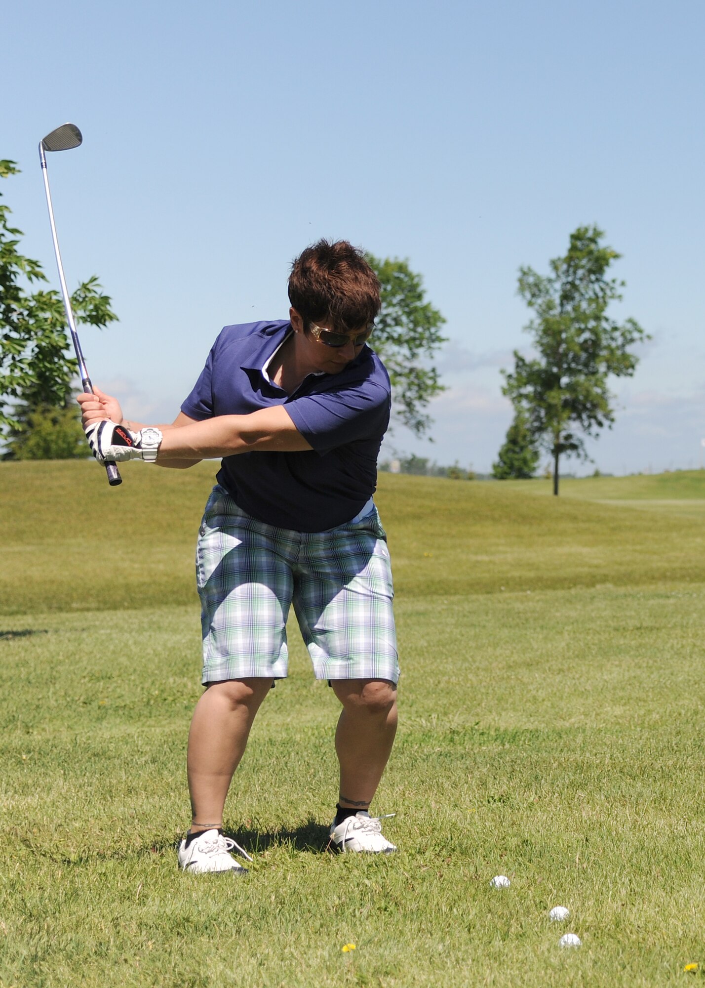 Maj. Wendy Leone, commander of the 319th Comptroller Squadron, takes a swing during the annual Military Affairs Committee golf tournament on June 18, 2012, on Grand Forks Air Force Base, N.D. (U.S. Air Force photo/Airman 1st Class Ashley N. Taylor) 