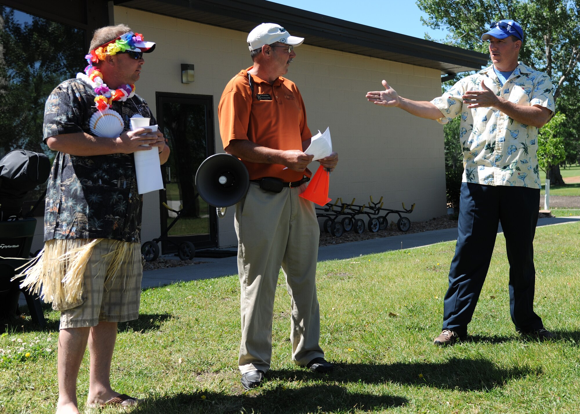 Col. Tim Bush, commander of the 319th Air Base Wing, right, thanks Stanley Bruggeman, Plainsview Golf Course manager, for hosting the annual Military Affairs Committee Golf Tournament on June 18, 2012, on Grand Forks Air Force Base, N.D. (U.S. Air Force photo/Airman 1st Class Ashley N. Taylor)