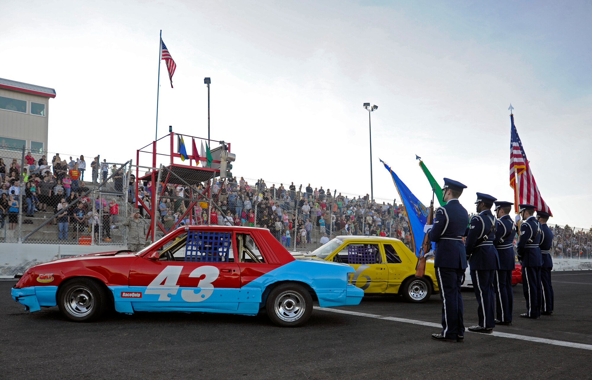The Fairchild Air Force Base Honor Guard present the colors at the Spokane County Raceway in Airway Heights, Wash., June 15, 2012. The race was held to honor military members during the 2nd Annual Military Appreciation Night. (U.S. Air Force photo by Airman 1st Class Ryan Zeski/Released)