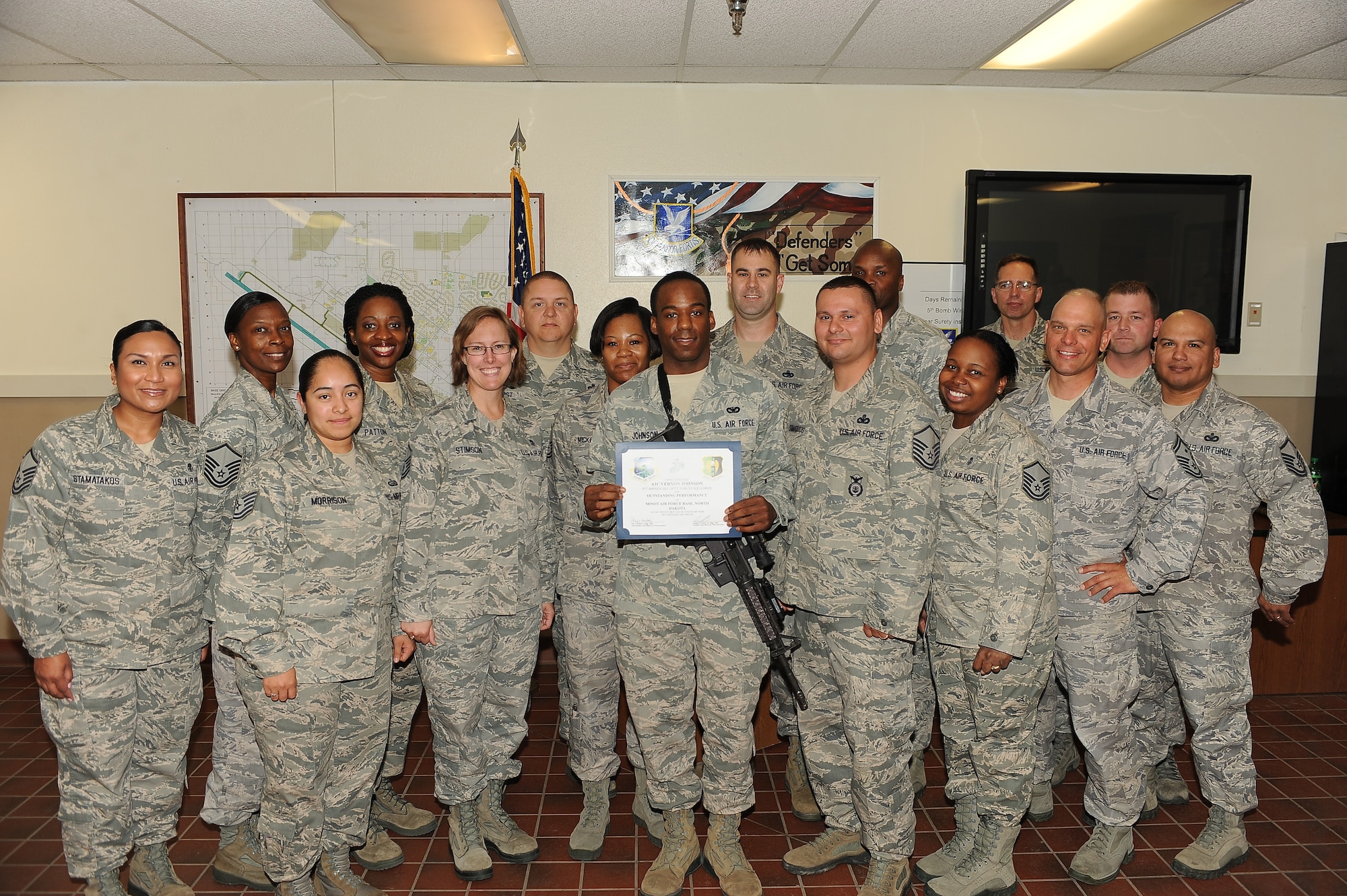 MINOT AIR FORCE BASE, N.D. -- Airman 1st Class Vernon Johnson, 91st Missile Security Forces Squadron team member, was presented with Team Minot's Top 3 Airman in Excellence Award for the month of June. Johnson was nominated for the award by his flight chief for being a stellar performer within his unit in support of the 91st Missile Wing's mission. Johnson performs as a Response Force Leader and is charged with the security of PL-1 assets as well as the training and mentoring of newly assigned personnel. This month alone he has trained four personnel for their duty position qualification evaluations with a 100 percent pass rate. (U.S. Air Force photo/Airman 1st Class Kristoffer Kaubisch)