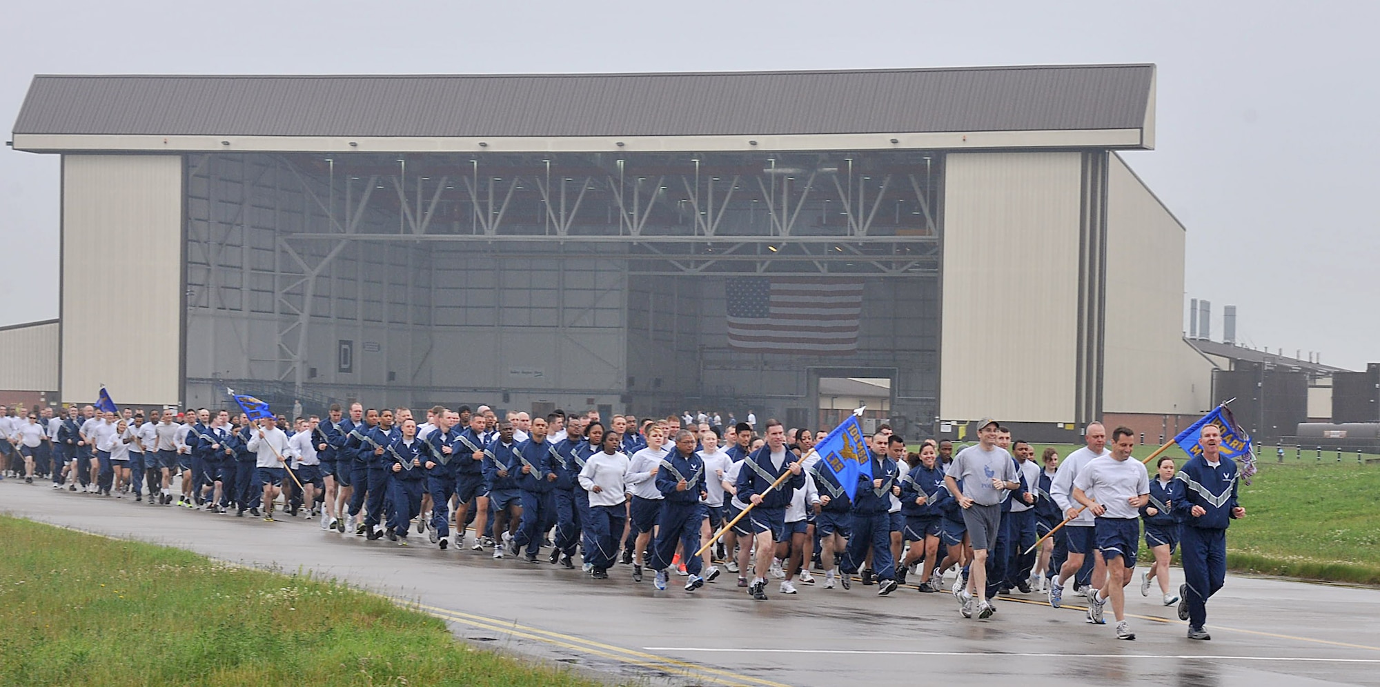 RAF MILDENHALL, England – Team Mildenhall members braved the rain June 21, 2012, as they participated in the ‘Marauder Melee’ at RAF Mildenhall. The event started with a 100th Air Refueling Wing run, in formation, on the taxiway behind Hangar 814. Other events took place throughout the base, including dodgeball, volleyball, a fitness challenge and an obstacle race. (U.S. Air Force photo/Senior Airman Ethan Morgan)