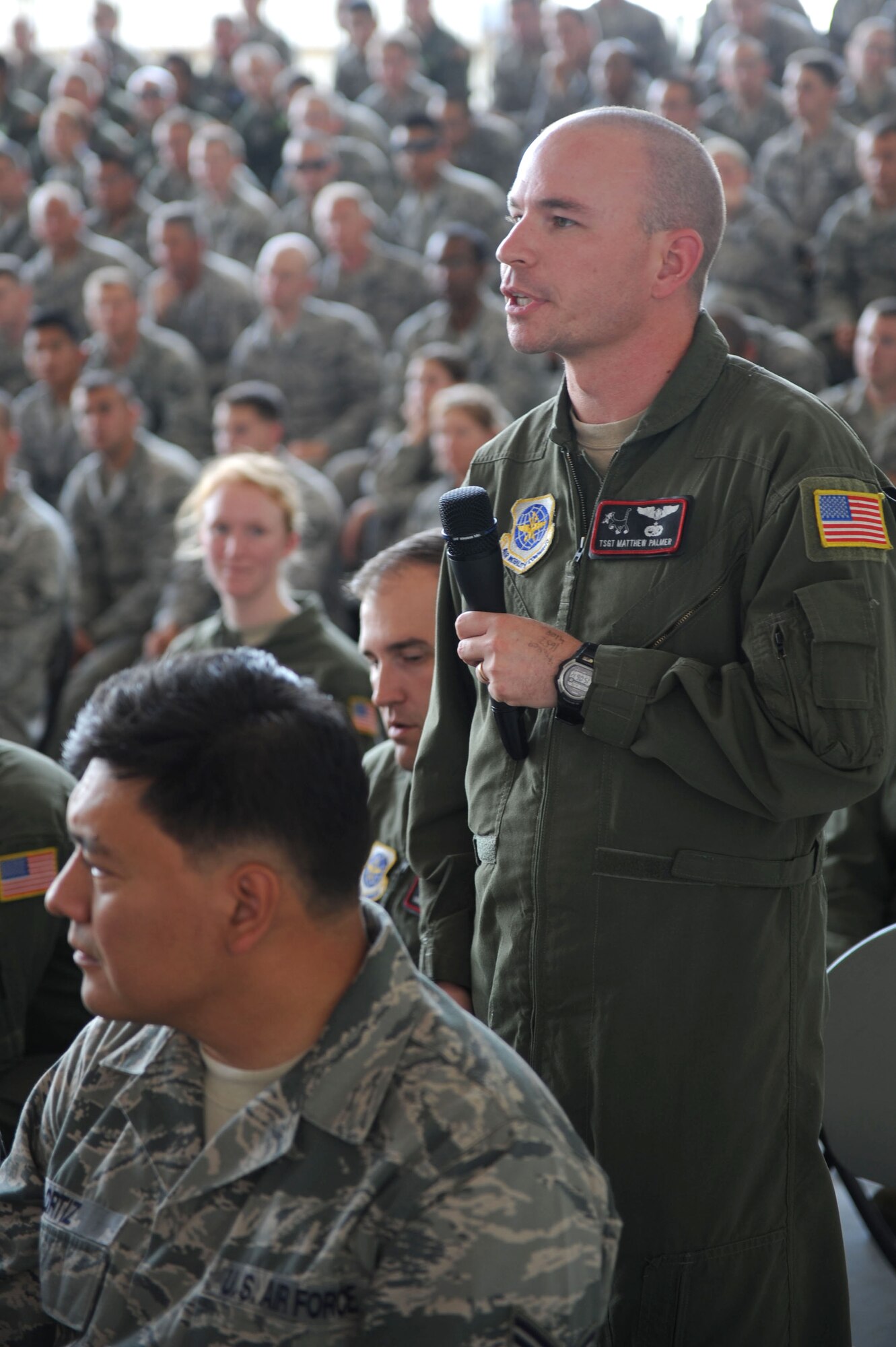Tech. Sgt. Matthew Palmer, a 41st Airlift Squadron C-130J loadmaster, asks a question to Air Force Chief of Staff Gen. Norton Schwartz during an all call June 20, 2012, at Little Rock Air Force Base, Ark.  During the all call Schwartz reminded Airmen to remain exquisitely professional, elaborated on the future of tactical airlift at home and abroad, and  discussed the budget realities of today's force.  (RELEASED U.S. Air Force photo by Tech. Sgt. Chad Chisholm)
