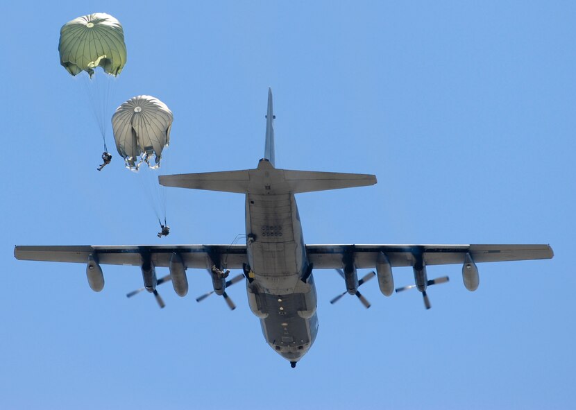 U.S. Air Force Airmen from the 820th Base Defense Group descend to a drop zone from an HC-130P Combat King at Henry Tift Myers Airport, Ga., June 19, 2012. Members on jump status are required to keep current on their training to remain jump qualified. (U.S. Air Force photo by Airman 1st Class Douglas Ellis/Released) 

