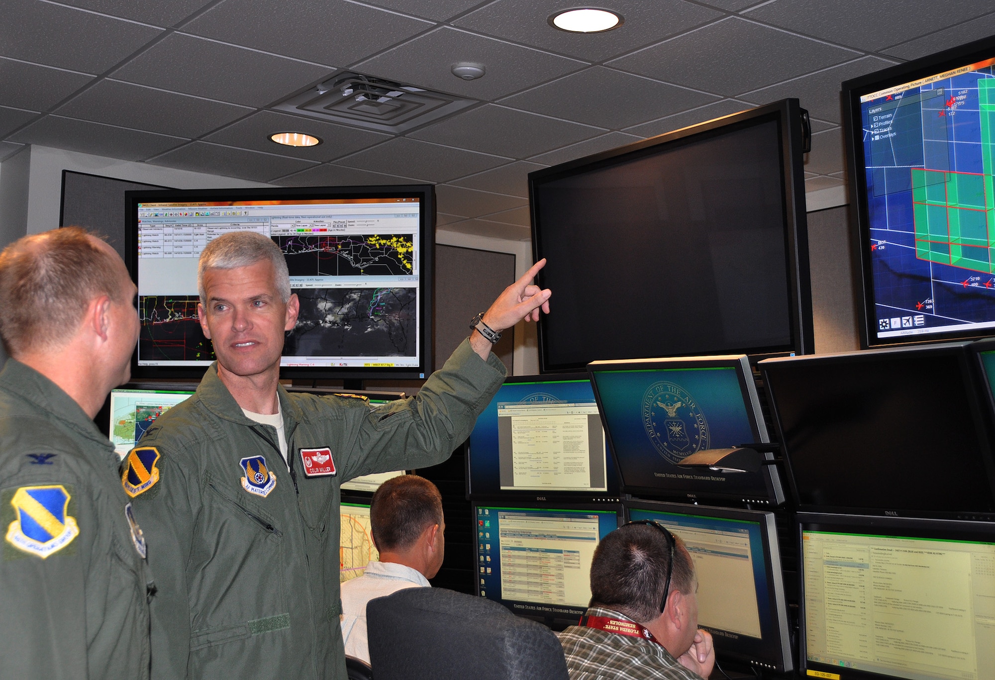 Col. Colin Miller, 46th Test Wing commander, tours the new Joint Test and
Training Operations Control Center. The JTTOCC was developed to increase
air, ground and water test and training missions on Eglin Air Force Base's range. (U.S. Air Force photo/Minty Knighton)  
