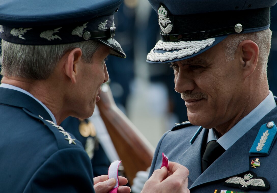 Air Force Chief of Staff Gen. Norton Schwartz presents Maj. Gen. Malek Salameh Habashneh, Royal Jordanian Air Force commander, the Legion of Merit, Degree of Commander, during an official arrival ceremony June 19, 2012, at the Air Force Memorial in Arlington, Va. General Malek is visiting the United States as part of the U.S. Air Force Chief of Staff Counterpart Visit Program. (U.S. Air Force photo/Senior Airman Perry Aston)

