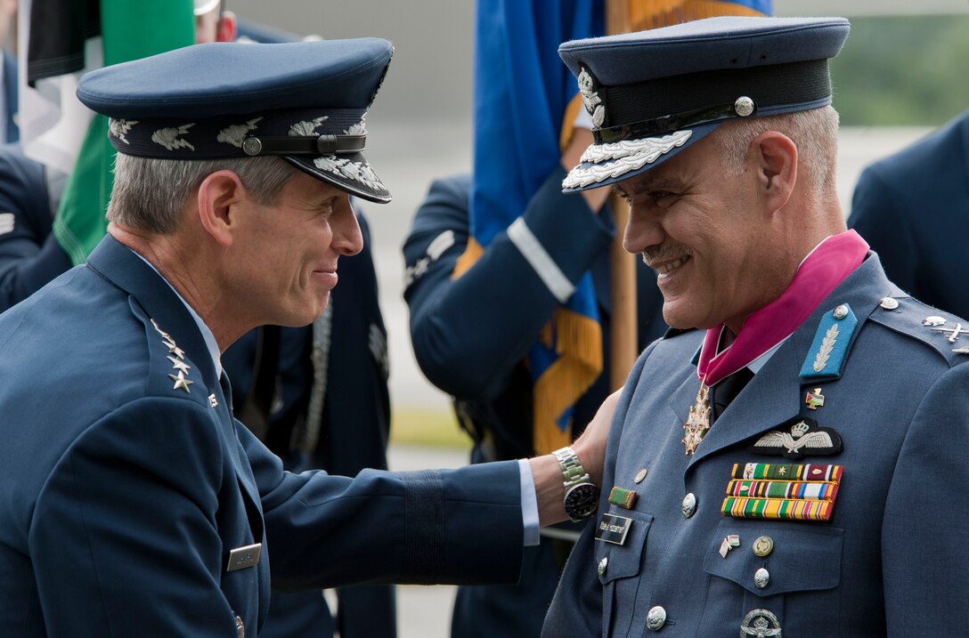 Air Force Chief of Staff Gen. Norton Schwartz presents Maj. Gen. Malek Salameh Habashneh, Royal Jordanian Air Force commander, the Legion of Merit, Degree of Commander, during an official arrival ceremony June 19, 2012, at the Air Force Memorial in Arlington, Va. General Malek is visiting the United States as part of the U.S. Air Force Chief of Staff Counterpart Visit Program. (U.S. Air Force photo/Senior Airman Perry Aston)
