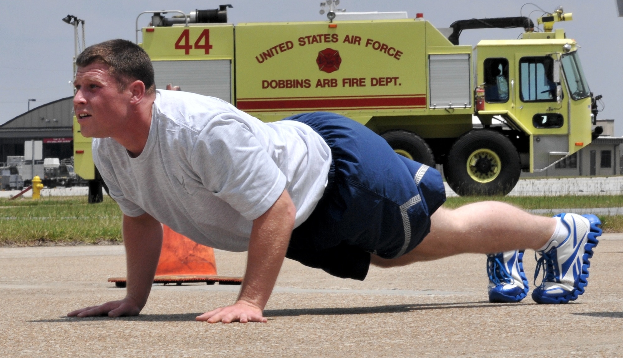 Tech Sgt. Gustav Schmidle, 96th Aerial Port Squadron, Little Rock Air Force Base, Ark., performs a ‘burpee’ – a fluid combination of a push-up, squat thrust and jumping jack – during a tough physical test at the Air Force Reserve’s 2012 Port Dawg Challenge at Dobbins Air Reserve Base, Ga. June 20, 2012. (U.S. Air Force photo/Master Sgt. Chris Durney)
